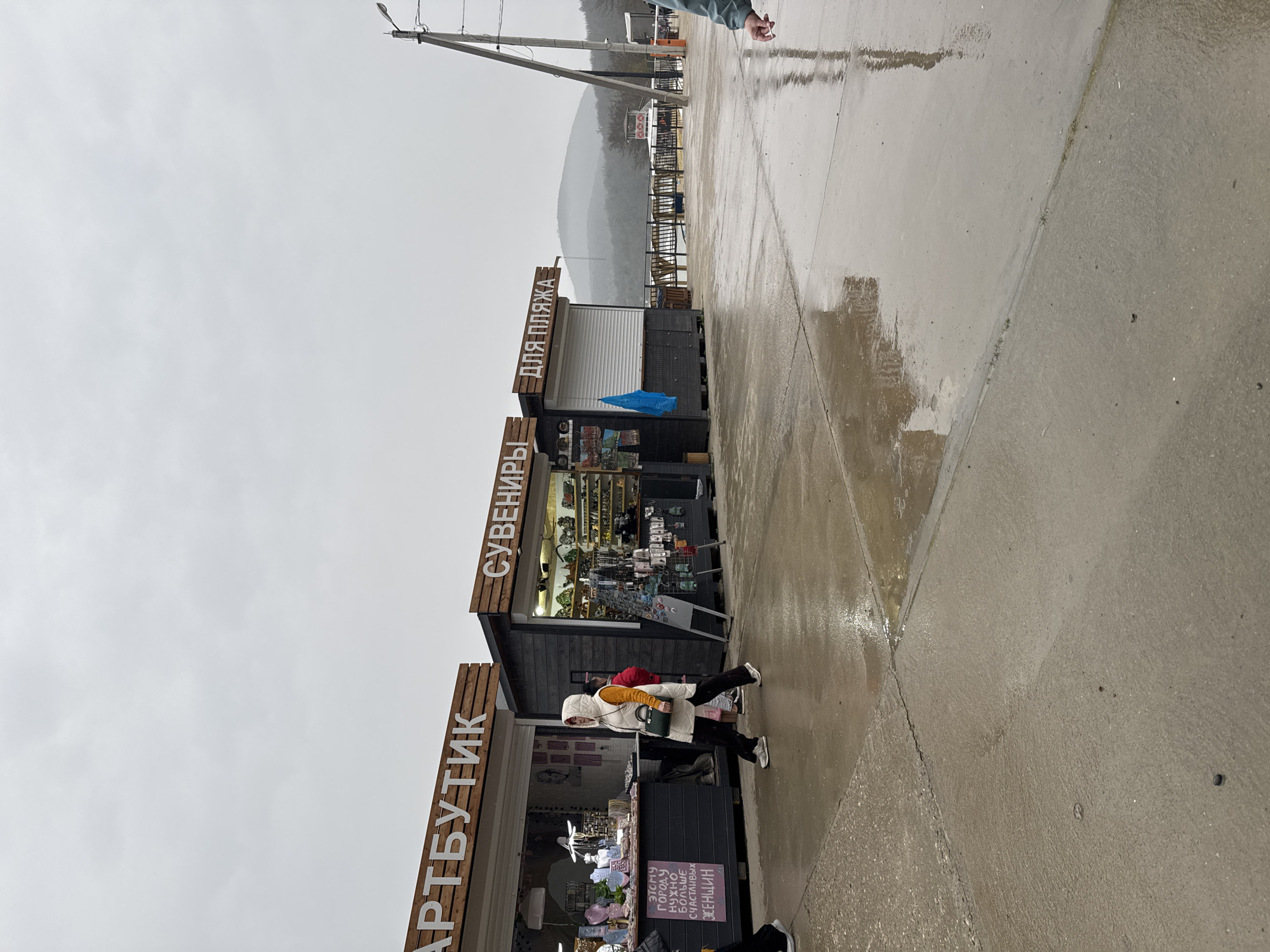 Tourists visit Lake Sukko attractions during rainy spring day