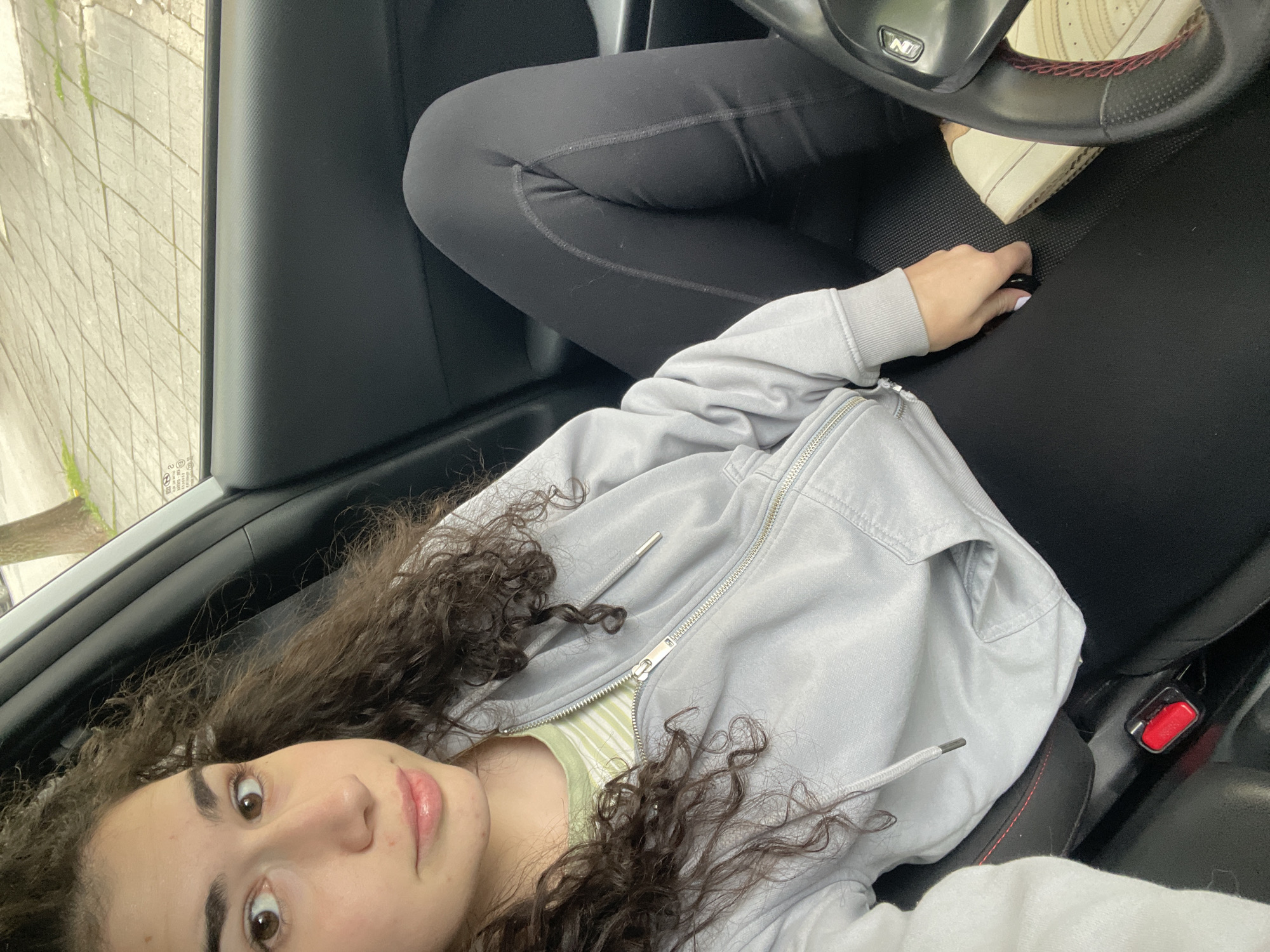 Woman documents casual morning moments in Sofia car and bedroom