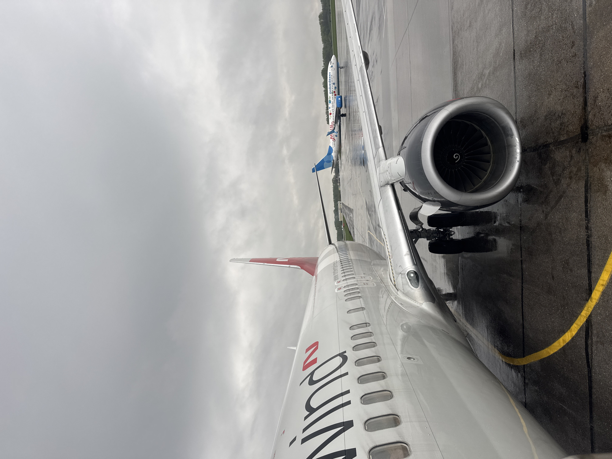 Aircraft spotted on wet tarmac at Perm airport
