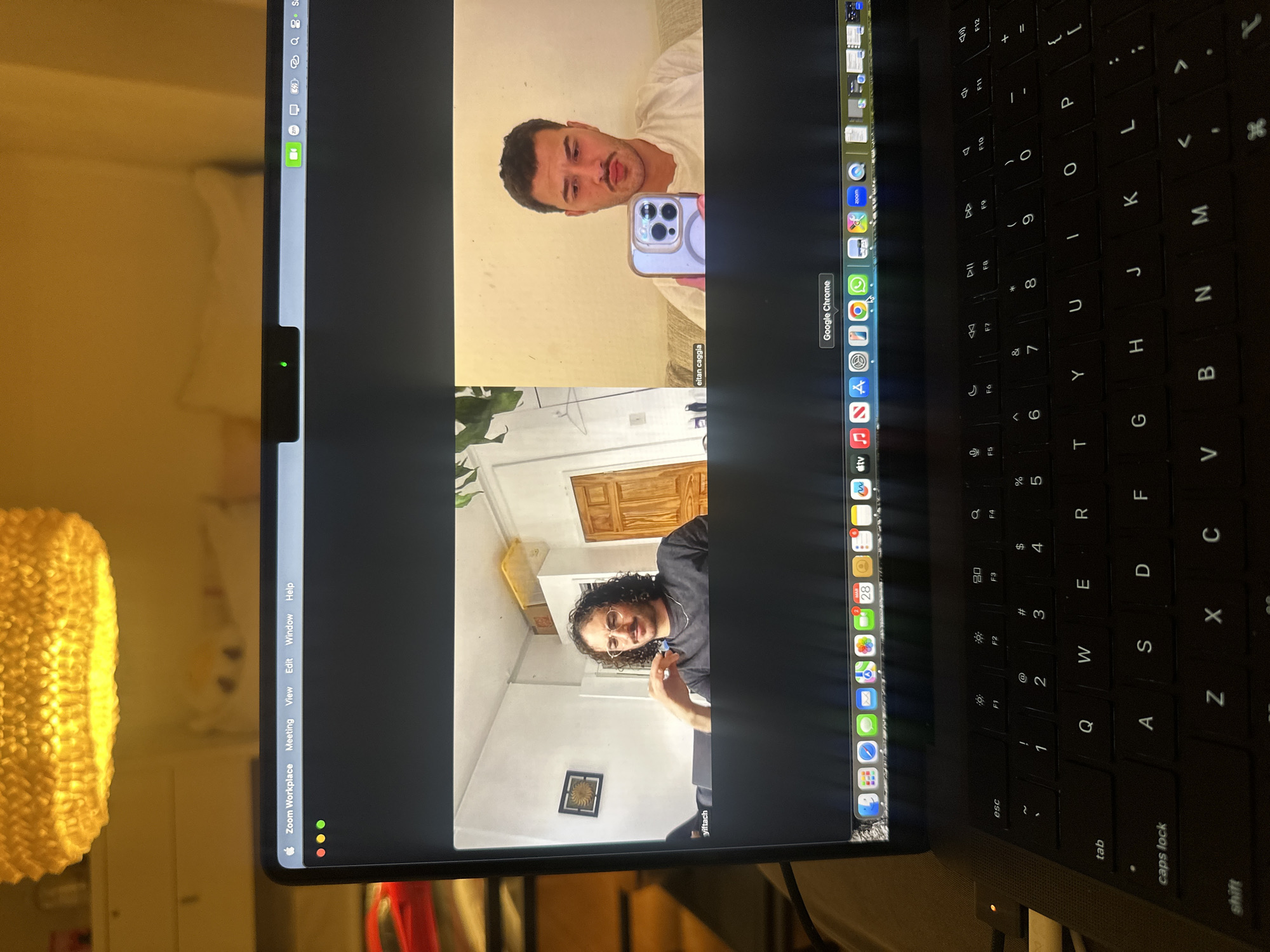 Remote meeting in progress on laptop in Milan