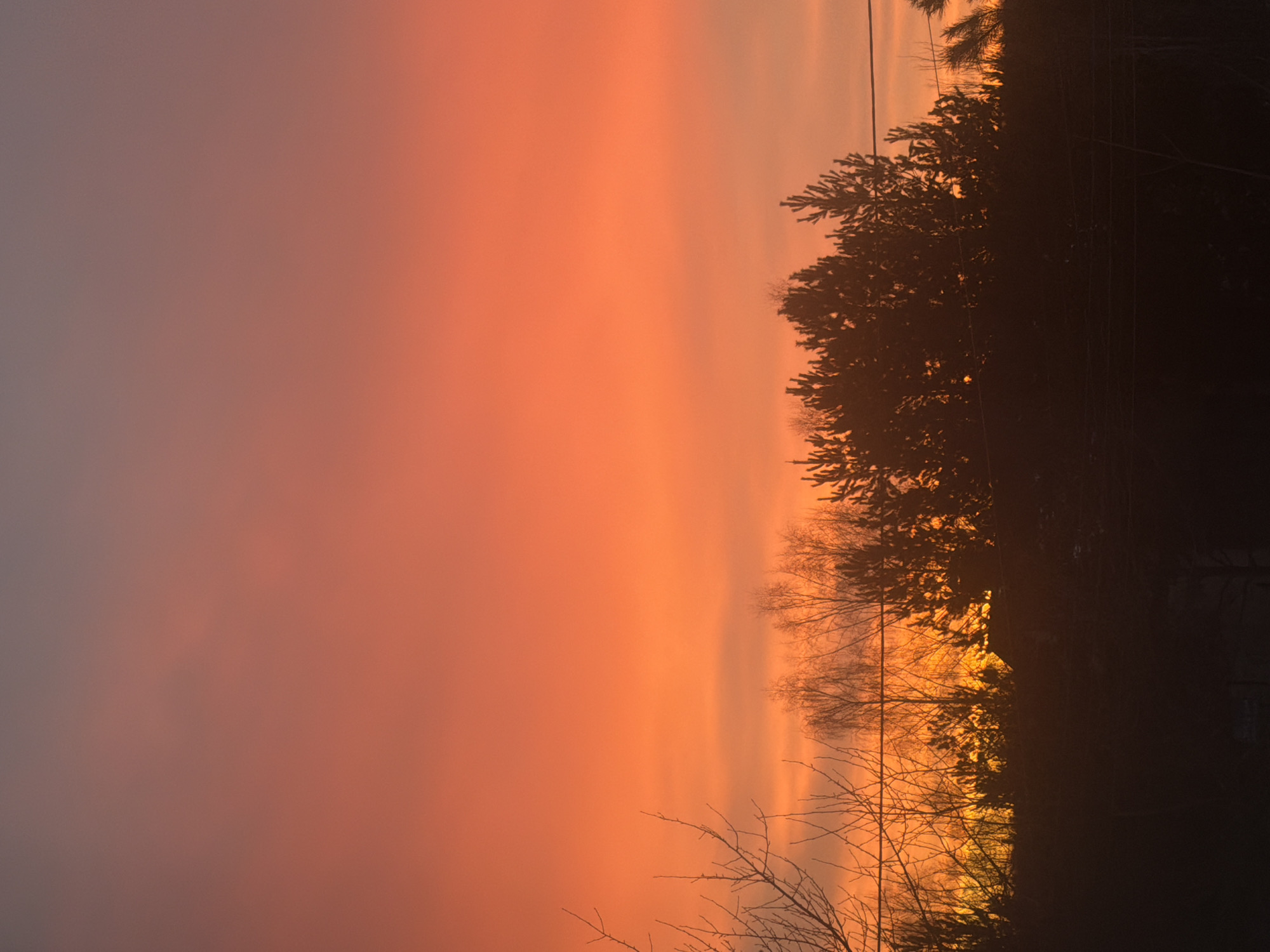 Vivid orange-red sunset observed in Markovo, Russia