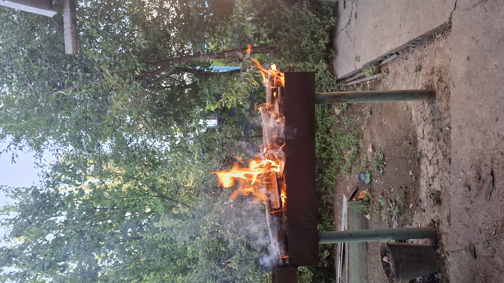 Backyard fire and everyday life in Shubarssu, Kazakhstan