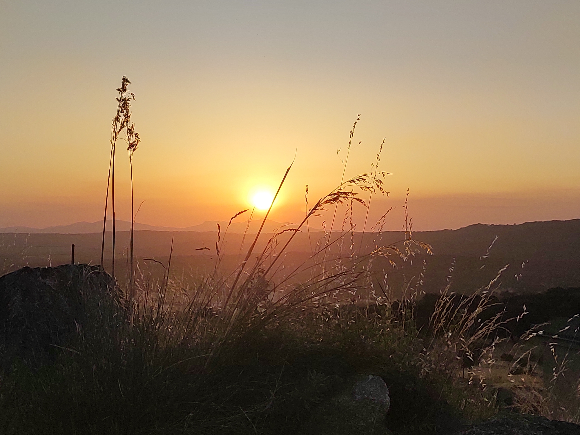 Motorhome parked at sunset in the hills outside Ledrada