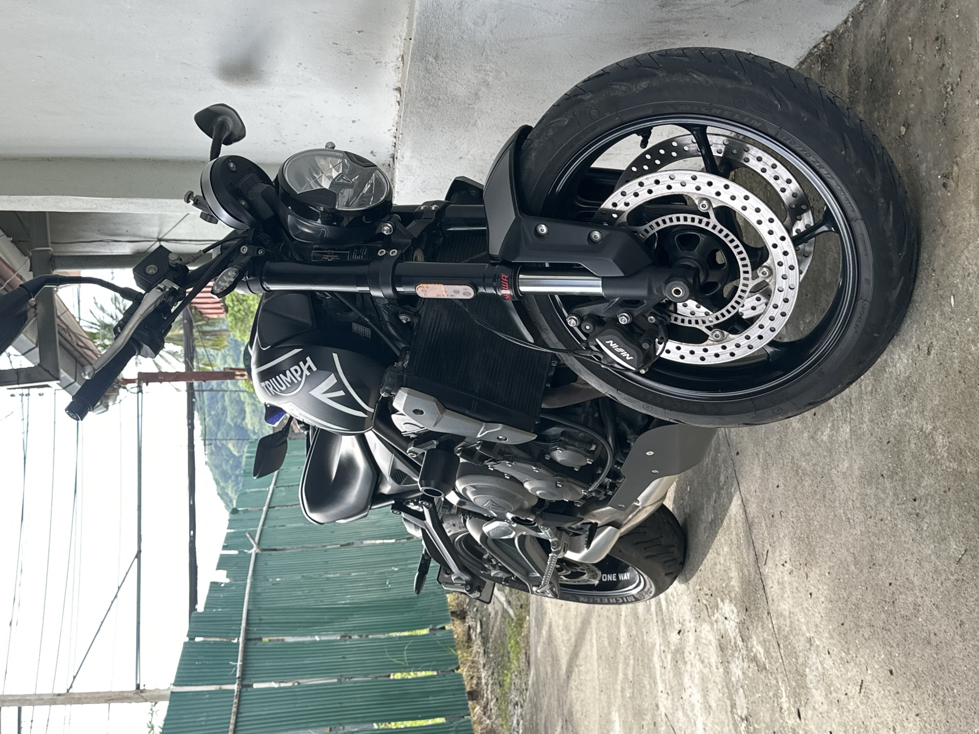 Sport bikes parked up in Karon, with a lizard stealing the show
