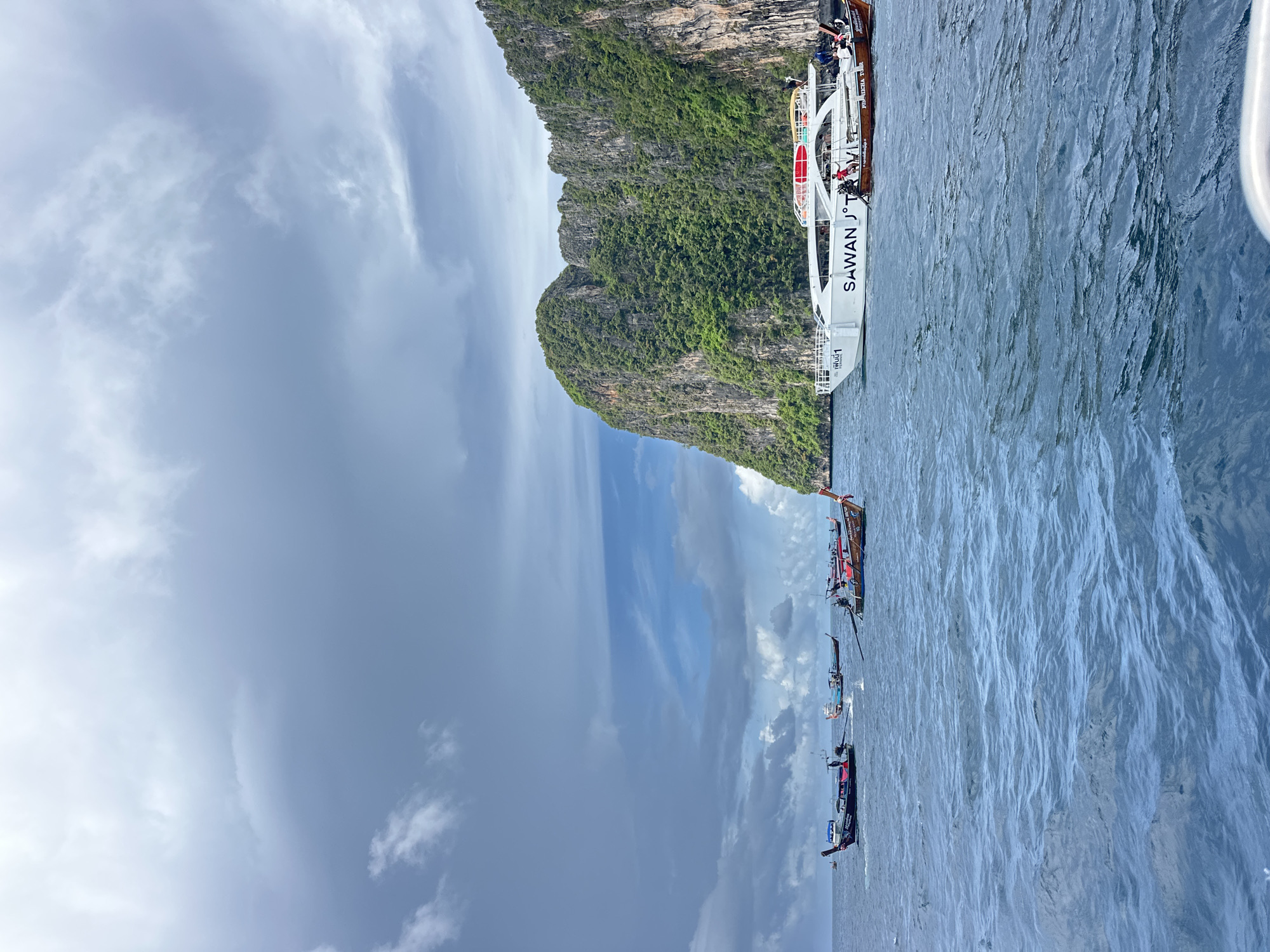 Longtail boats weaving through Koh Phi Phi's limestone karst waters