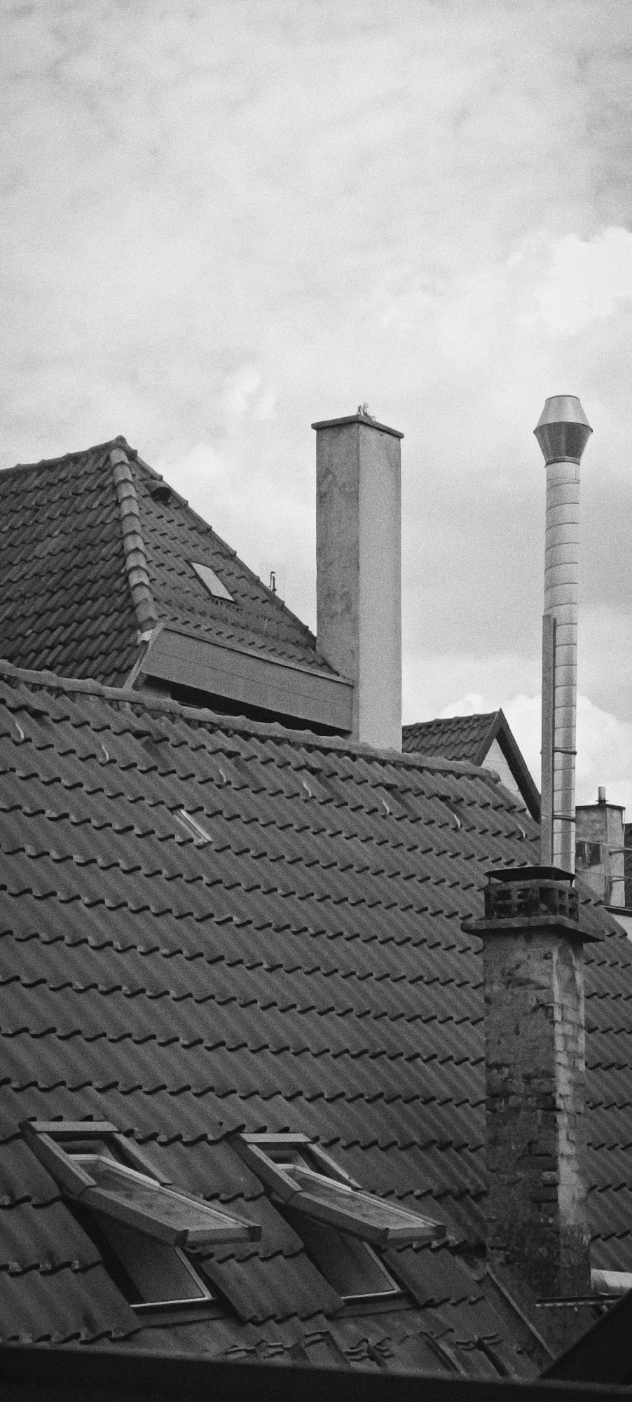 Black and white rooftop textures under overcast skies in Winnenden