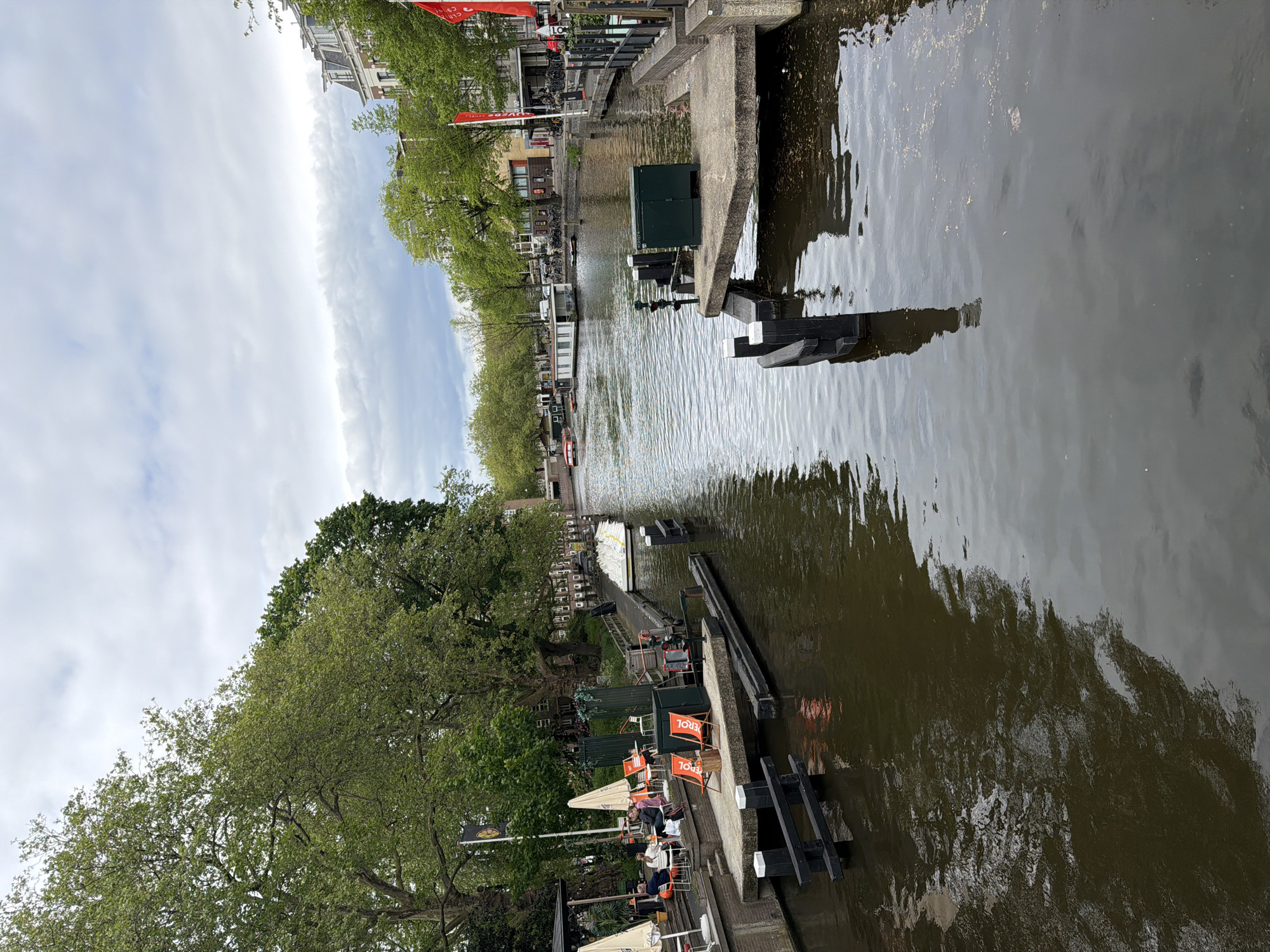 Amsterdam canal photographed under overcast skies, May 2026