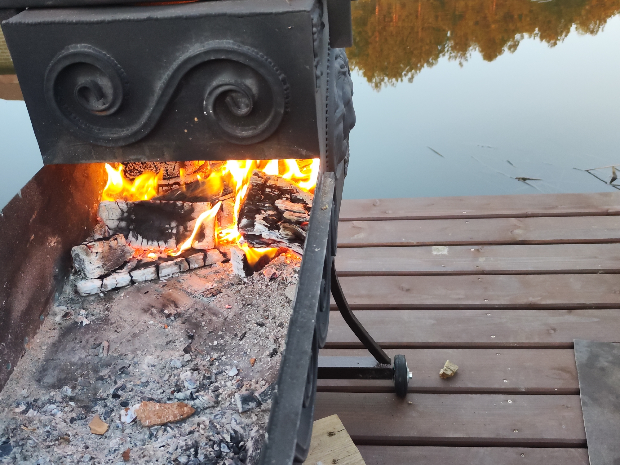 Outdoor fish smoking session documented in Chaikovsky, Russia