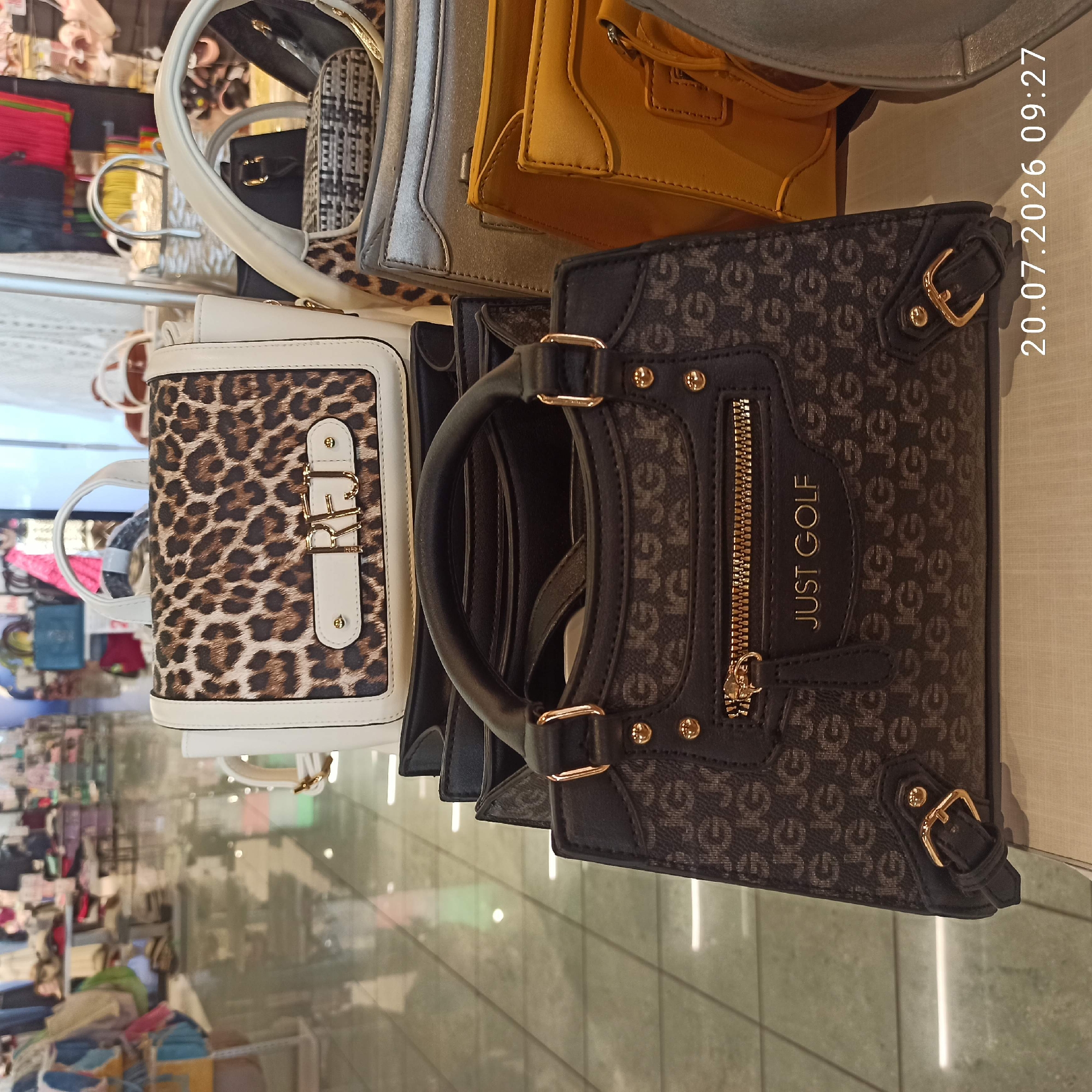 Browsing bags, clothes, and shoes at a Bari retail store