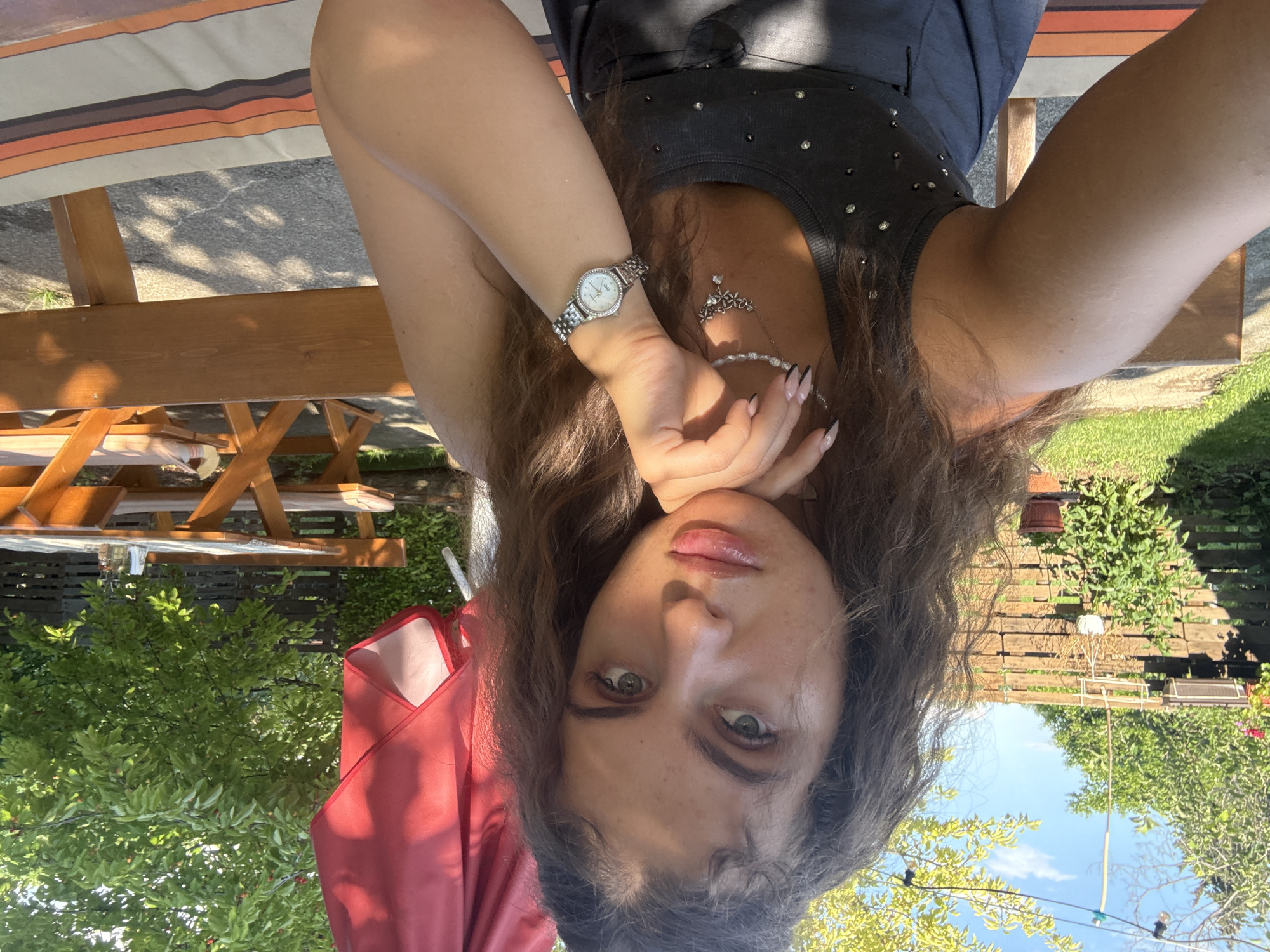 Woman enjoys outdoor lunch in Bulgarian village garden