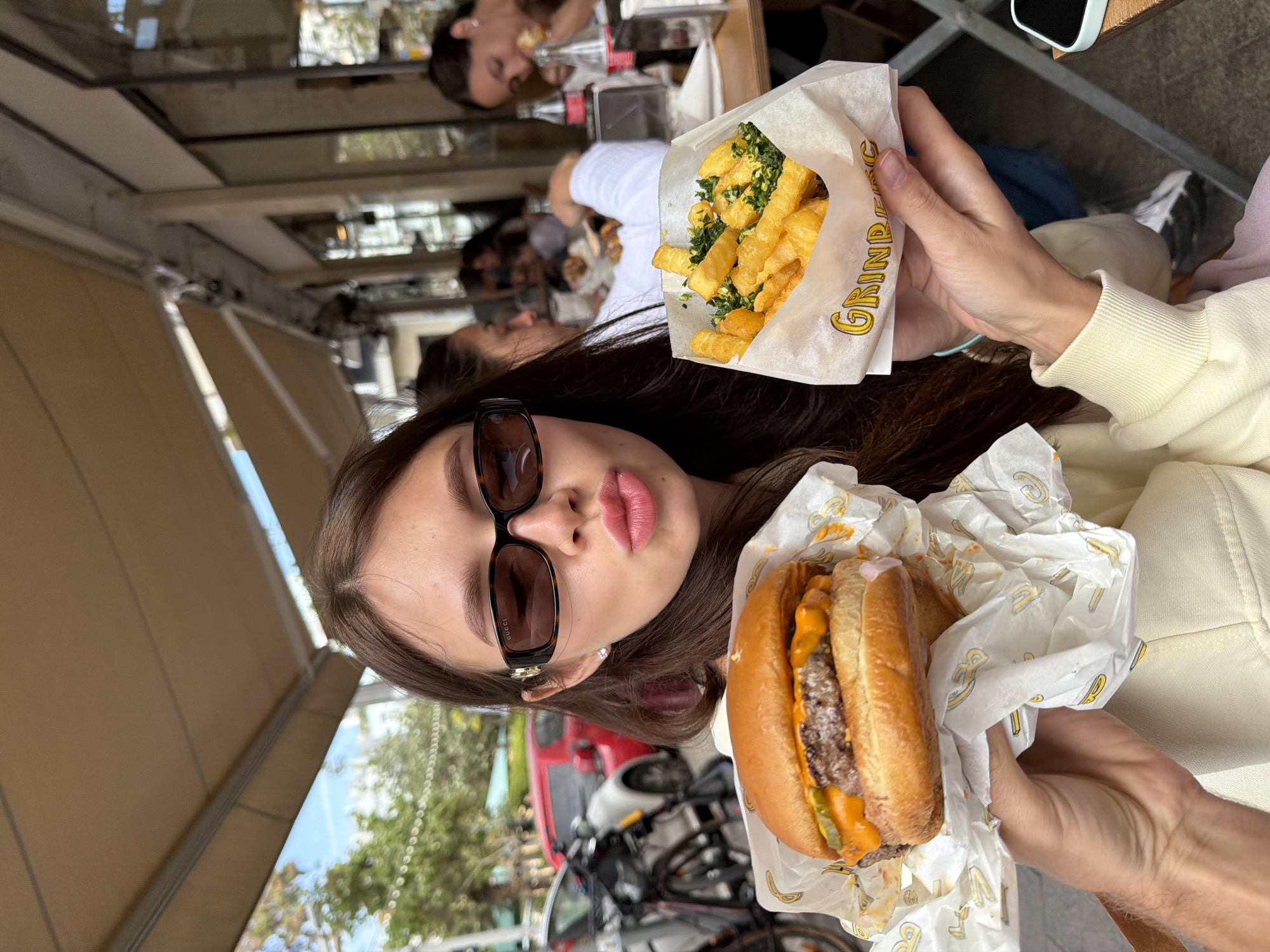 Woman enjoys outdoor lunch at Tel-Aviv restaurant