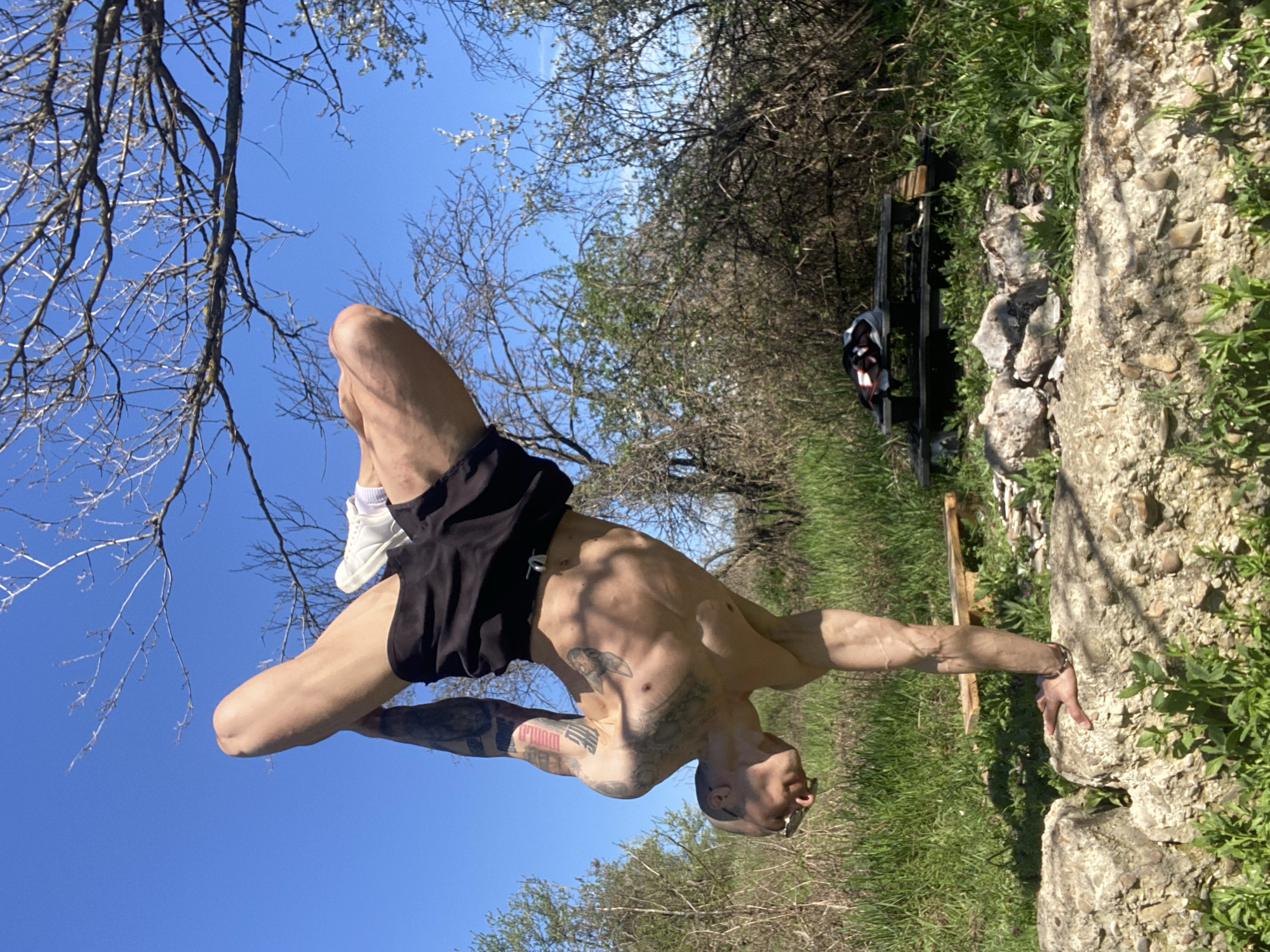Tattooed man exercises outdoors in Pleven Bulgaria morning session
