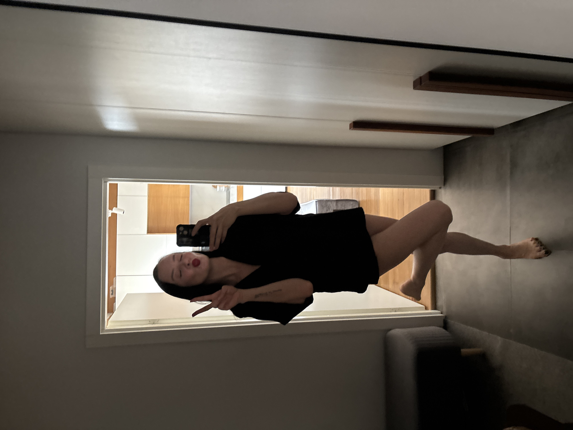 Woman takes playful mirror selfie in Chaikovsky, Russia