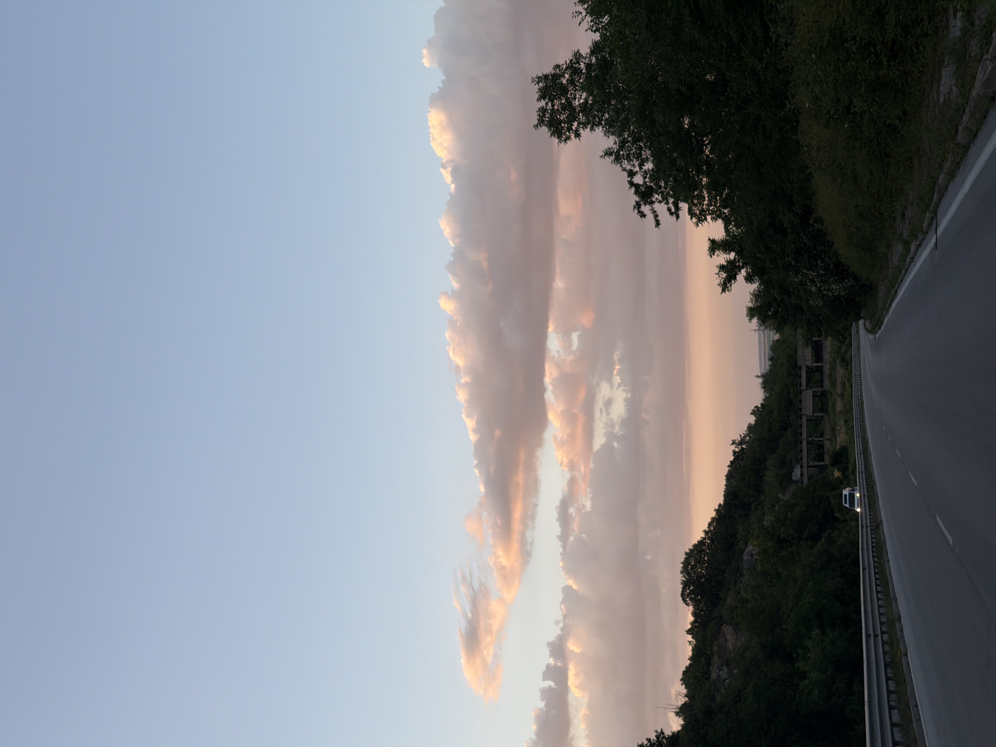 Road trip through Lovech with zinnias on the dashboard at dusk
