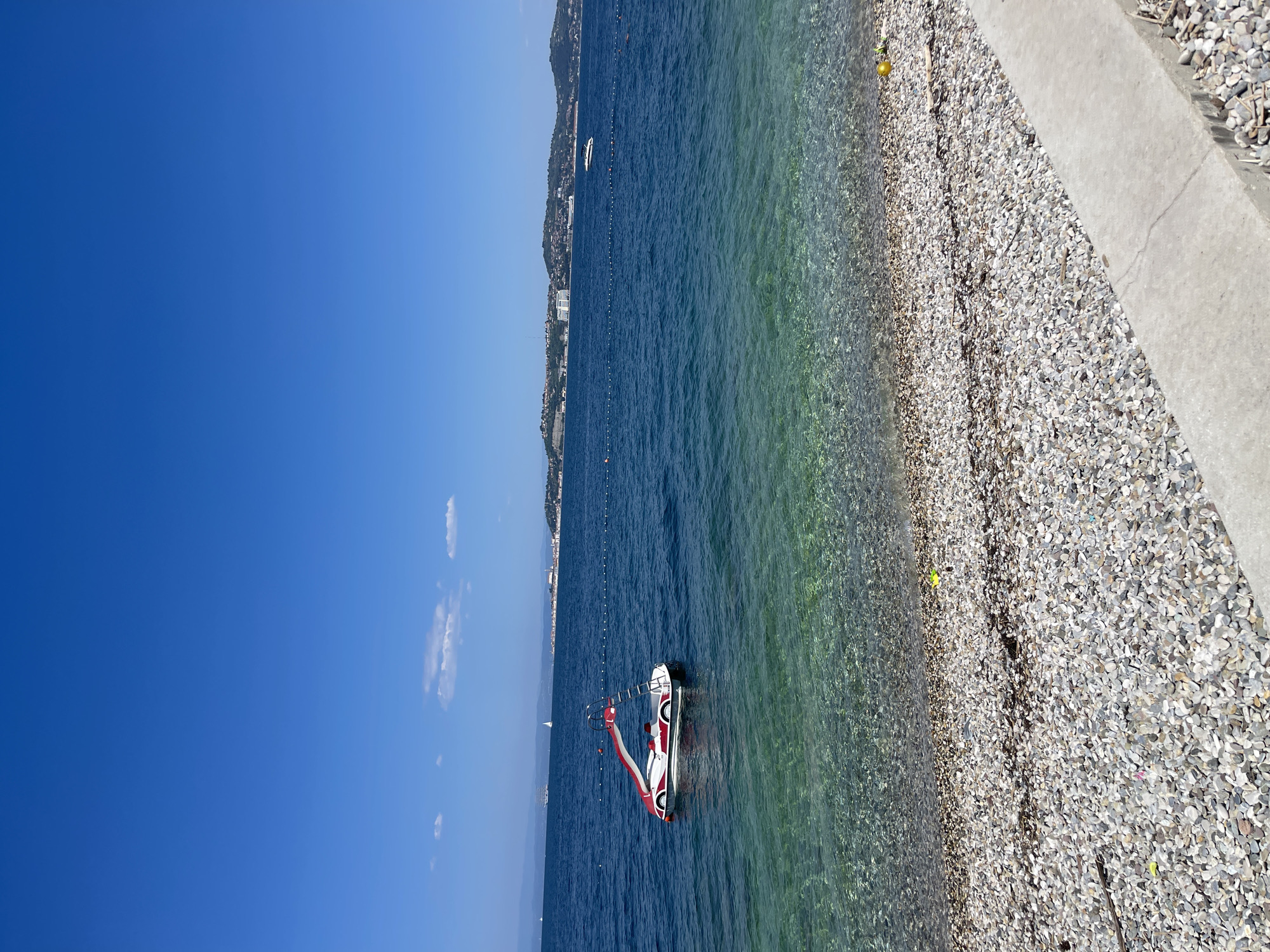 Beach resort day in Crveni Vrh, inflatables out, drinks poured