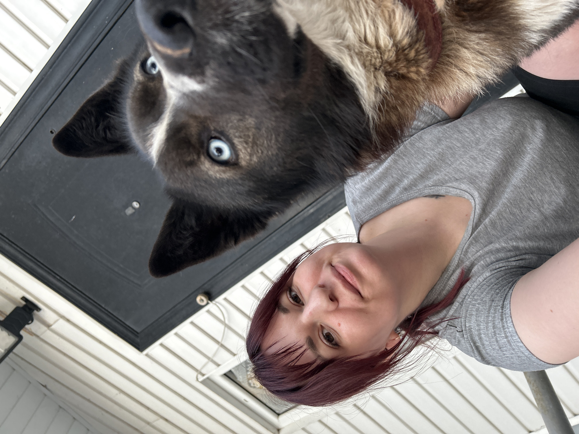Woman takes selfie with blue-eyed dog in Russia