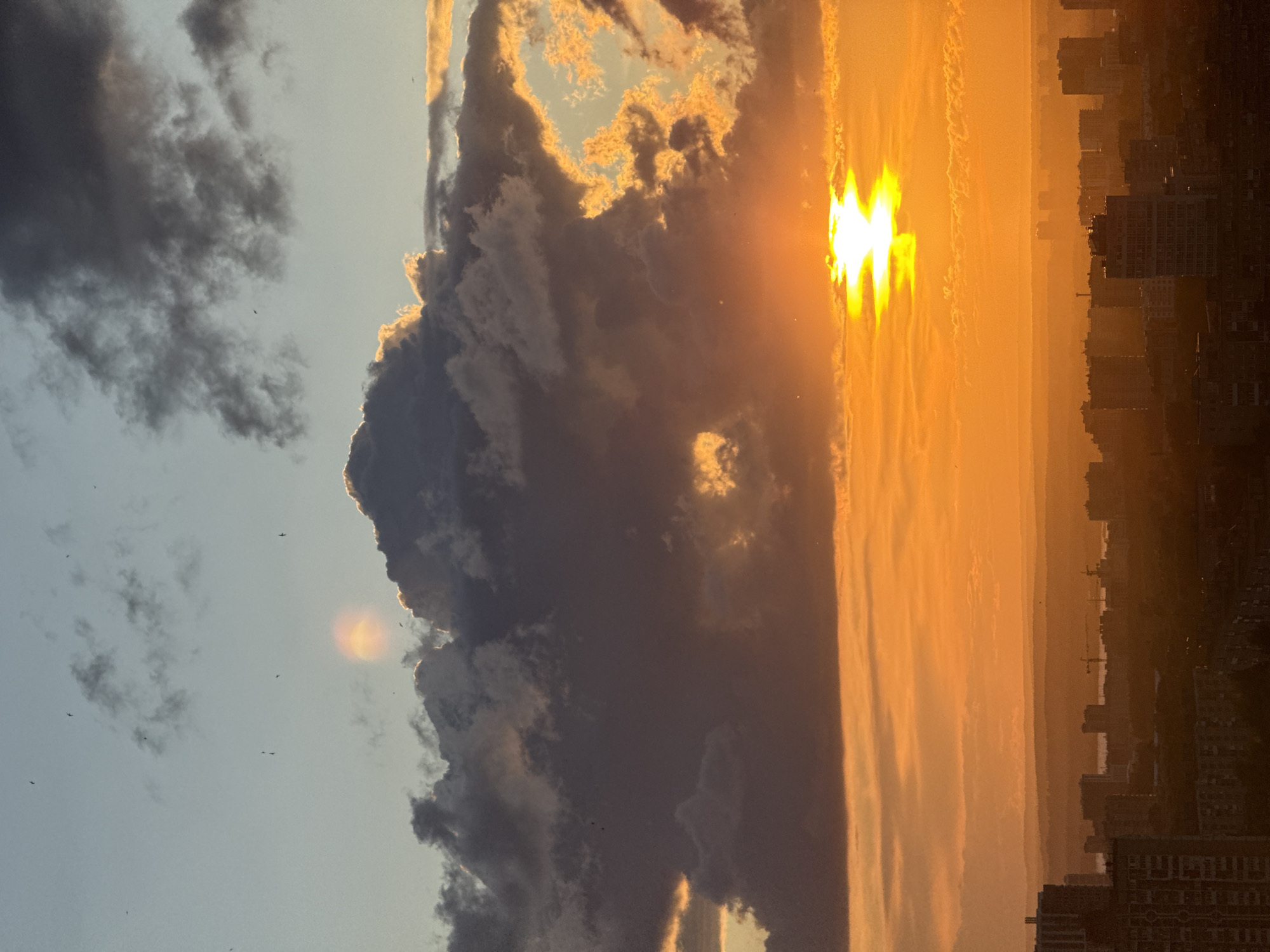 Dramatic sunset clouds over a Russian city skyline