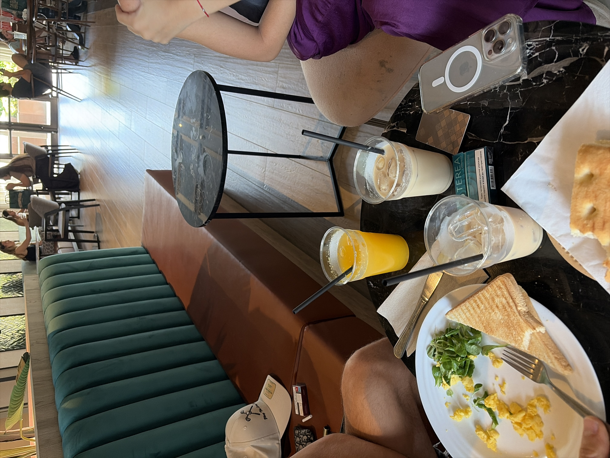 Brunch and phone time at Milan cafe