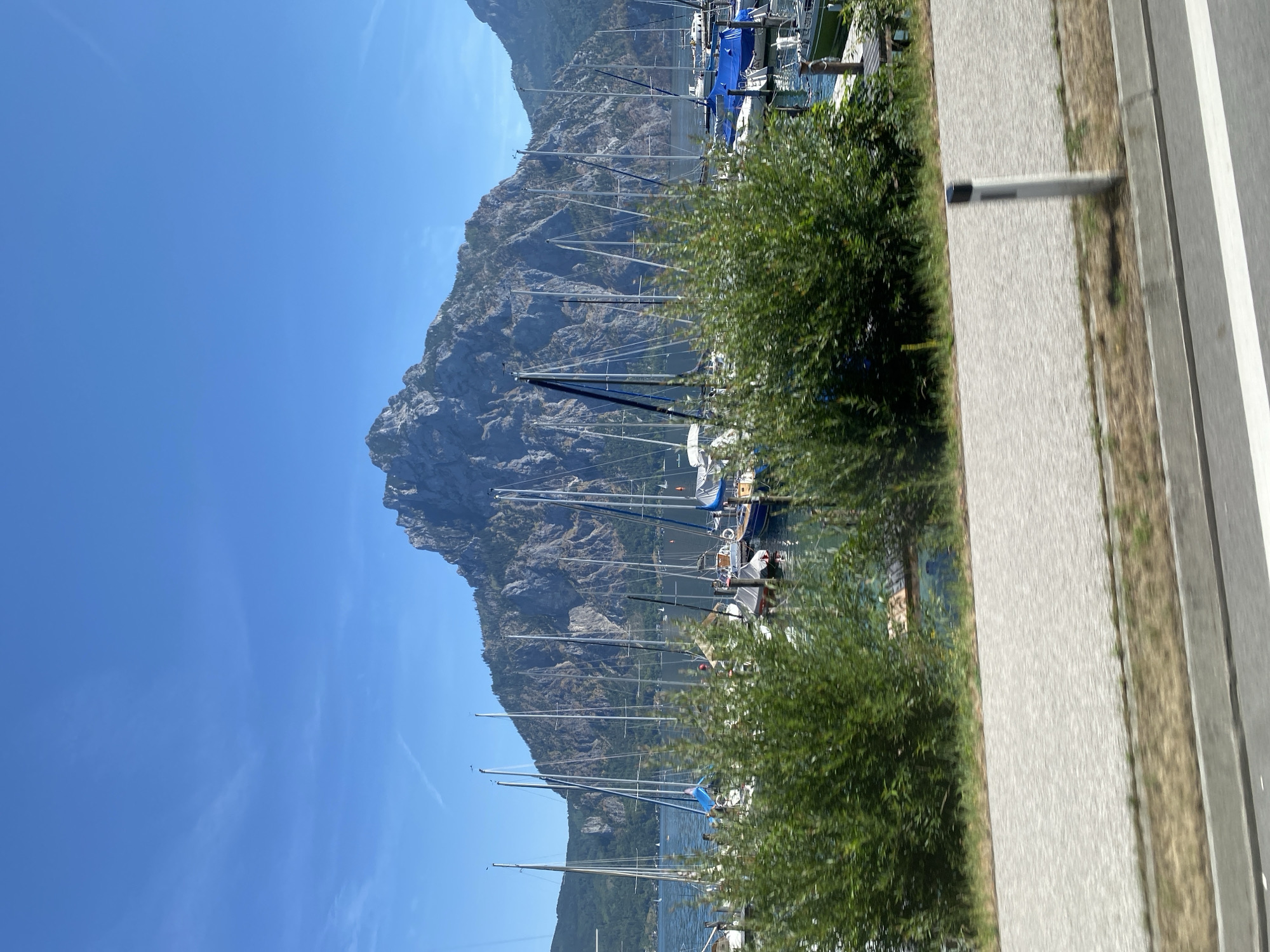 Sailboats moored beneath rocky alpine peaks in Traunkirchen