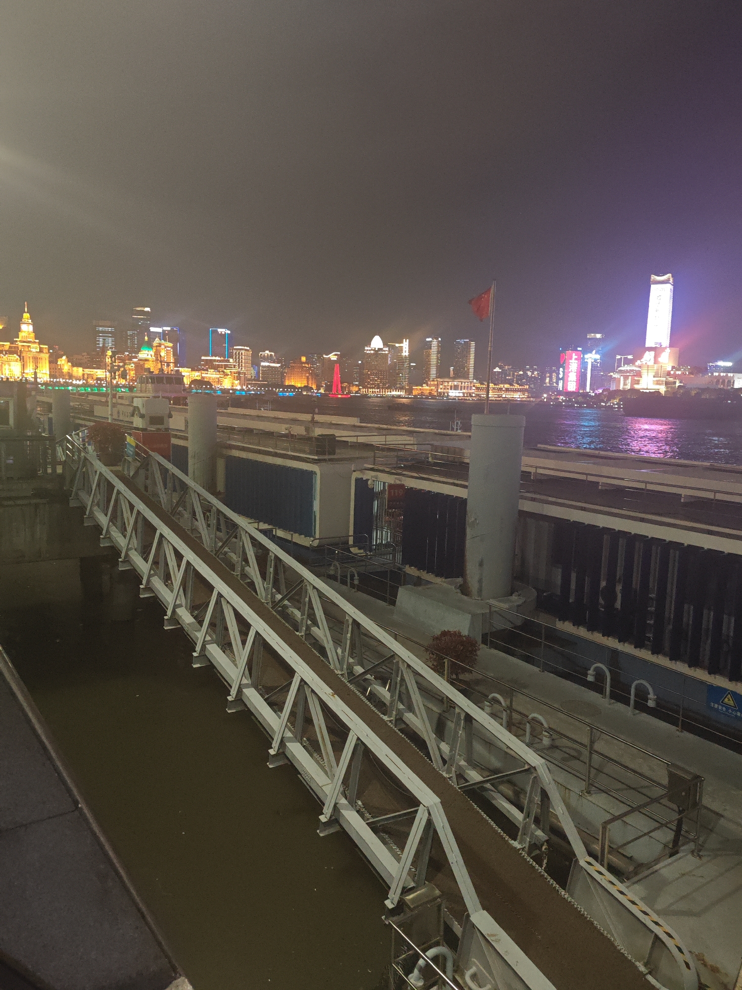 Witnesses capture nighttime Shanghai waterfront scenes across multiple districts
