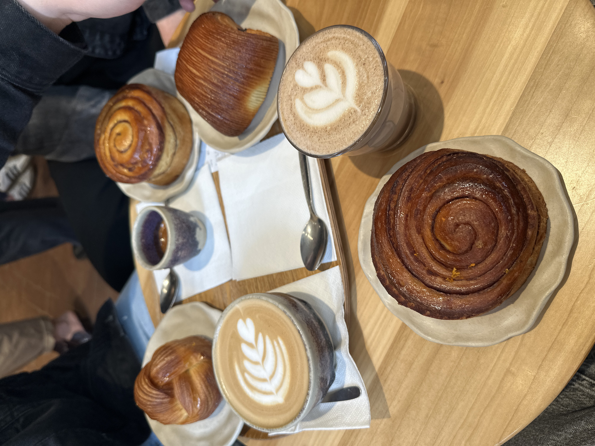 Morning cafe gathering with pastries documented in Milan