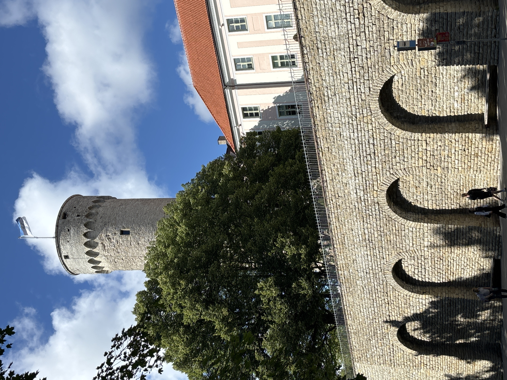 Walking Tallinn's Old Town landmarks on a clear summer morning