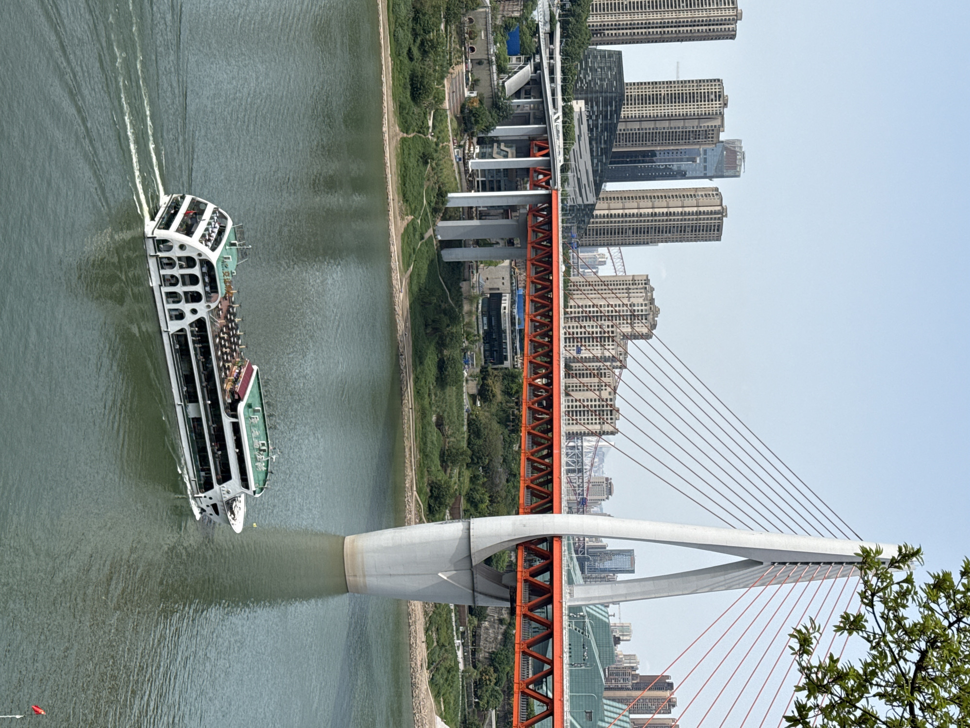 Passenger boat navigates river in Yuzhong District, China
