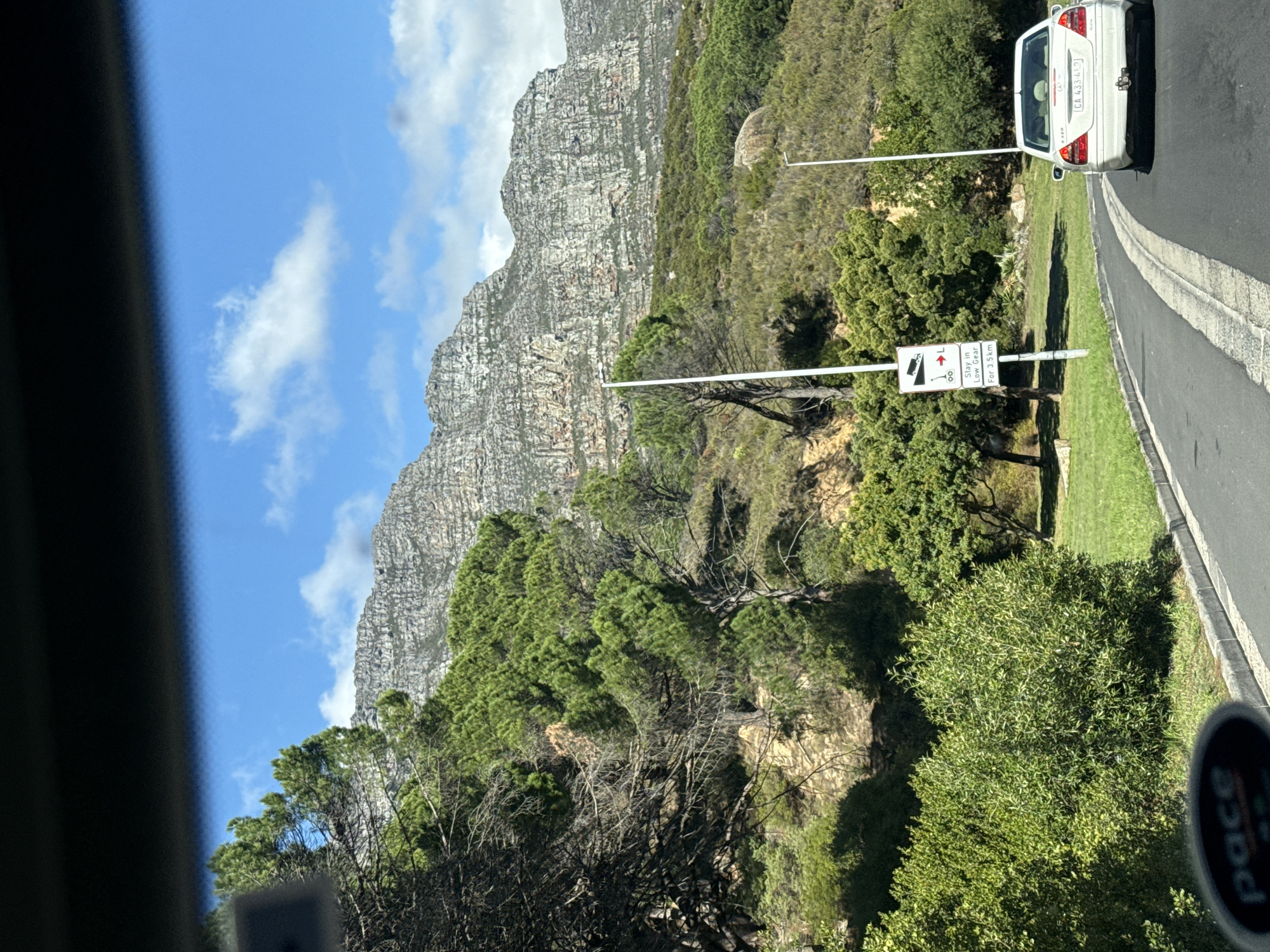 Table Mountain photographed from moving vehicle in Cape Town