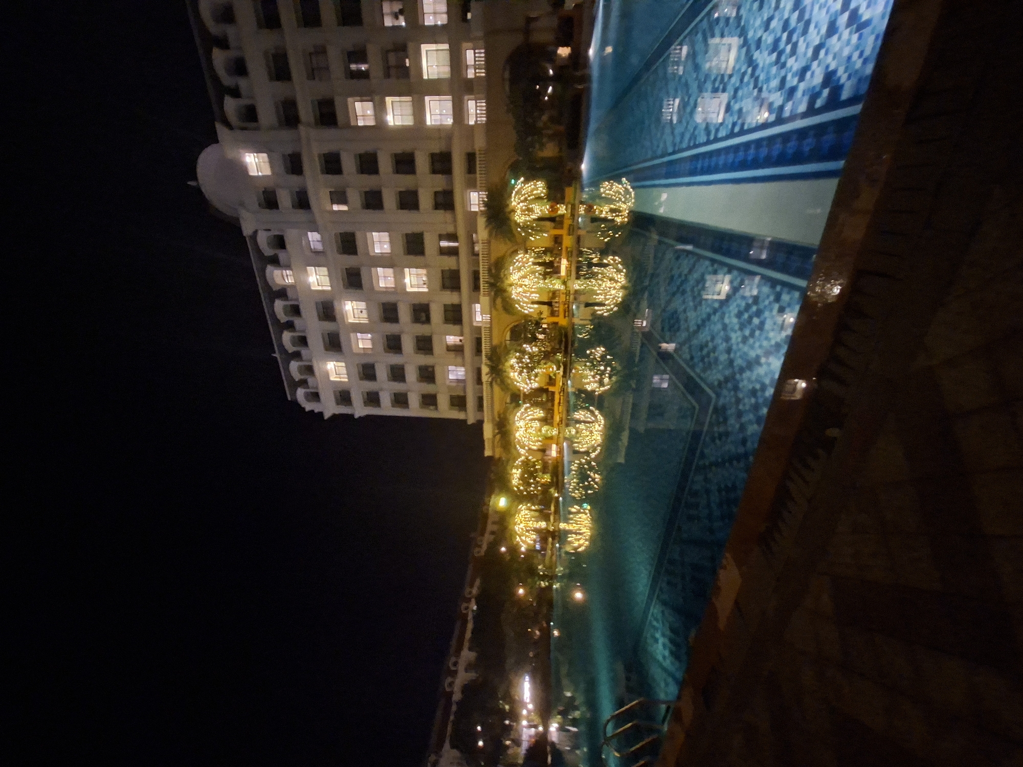 Nighttime hotel pool and facade, multiple angles