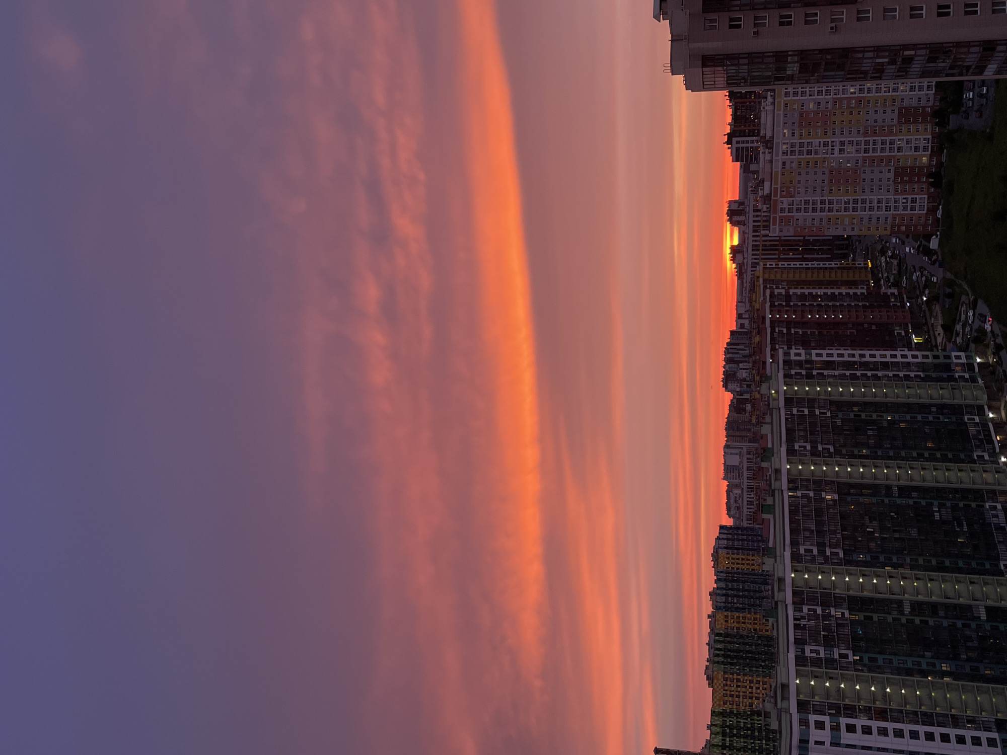 Vivid summer sunset over a dense Russian cityscape