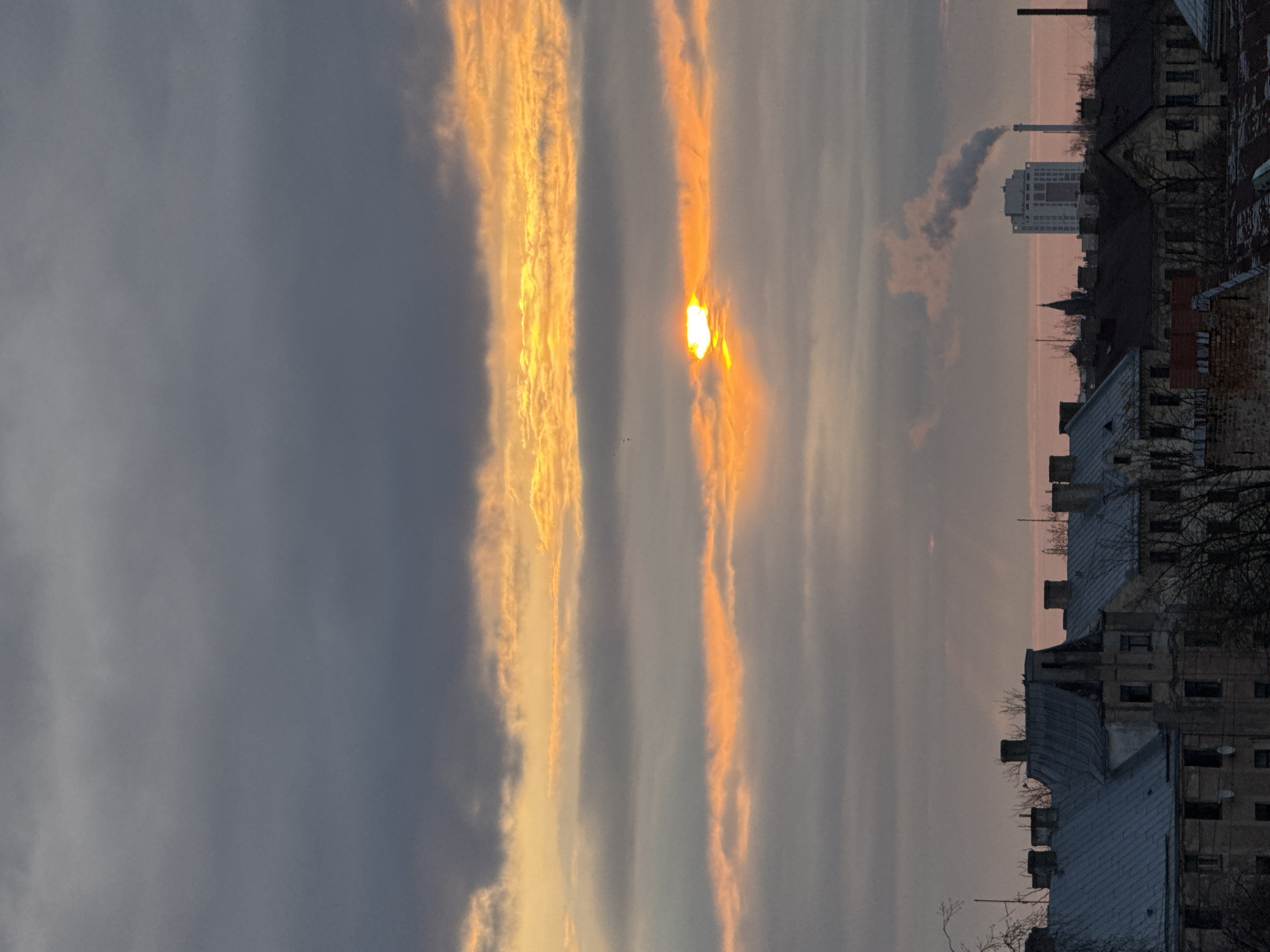 Orange sunset glow captured over Riga cityscape