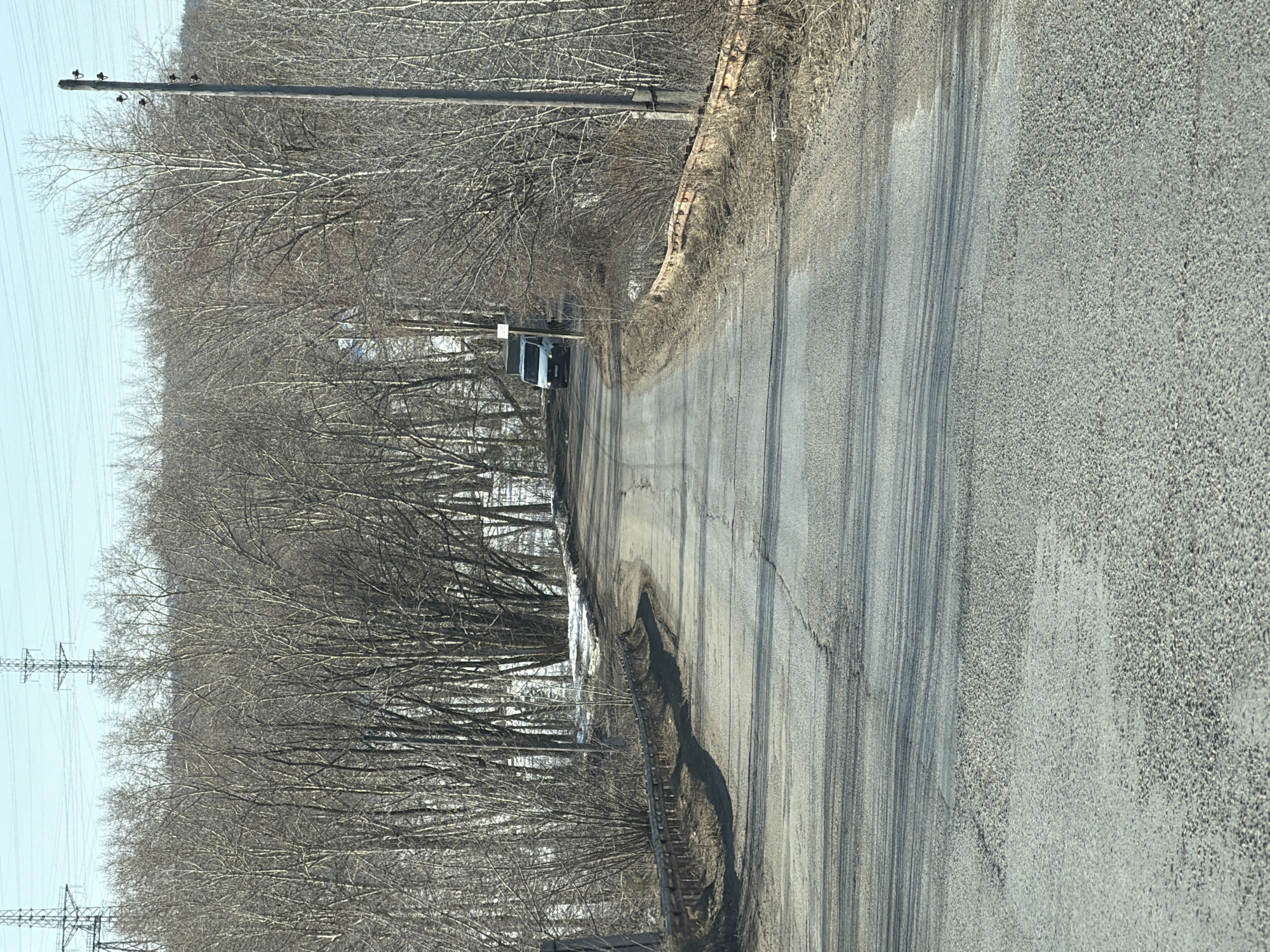 Cracked rural road documented in Chaikovsky outskirts