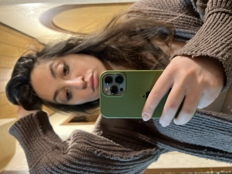 Woman takes morning selfies while grinding coffee in Wüstenrot