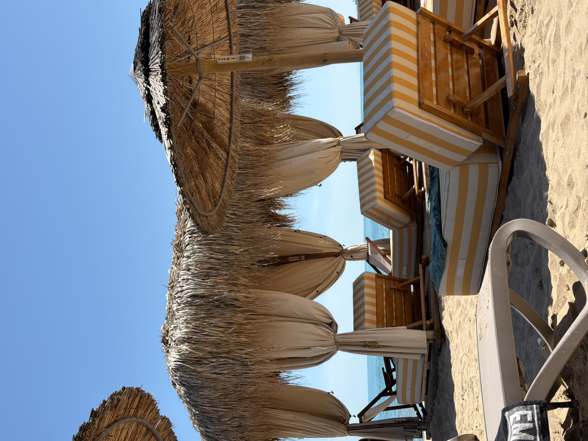 Beach loungers and umbrellas arranged at Varna seaside
