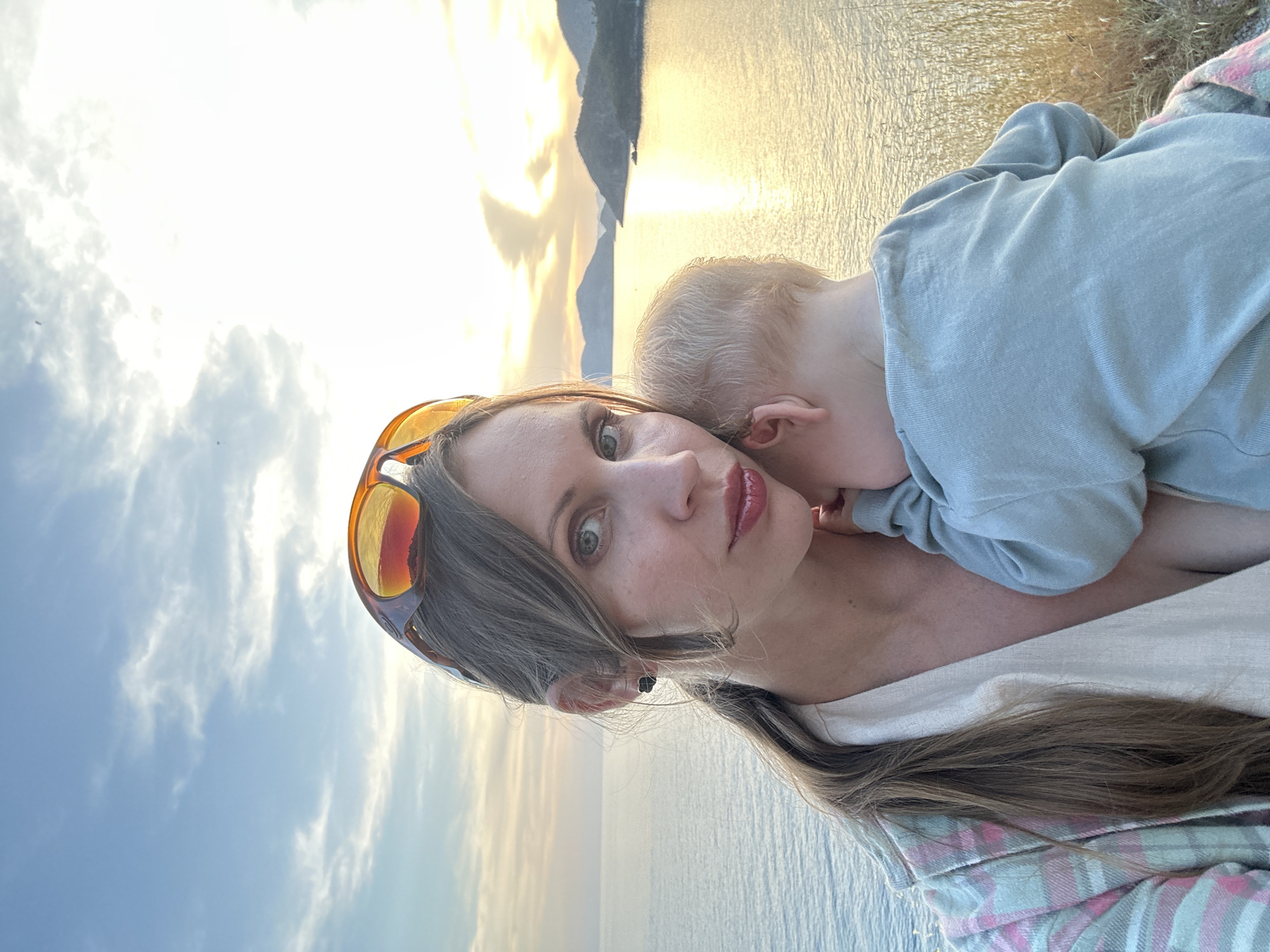 Mother and child enjoy sunset moment in Fethiye, Turkey