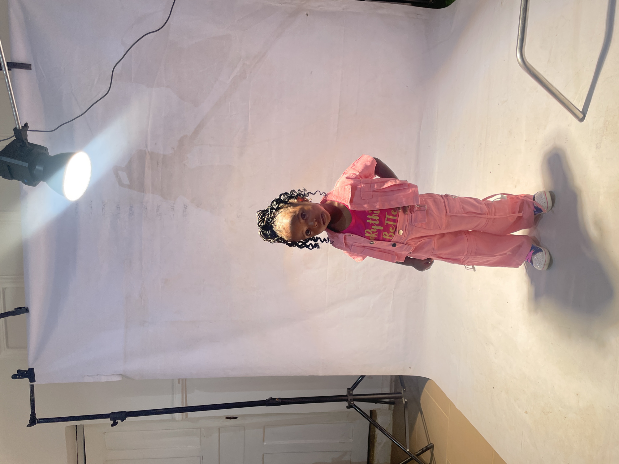 Girl poses for professional portrait session in Jos studio