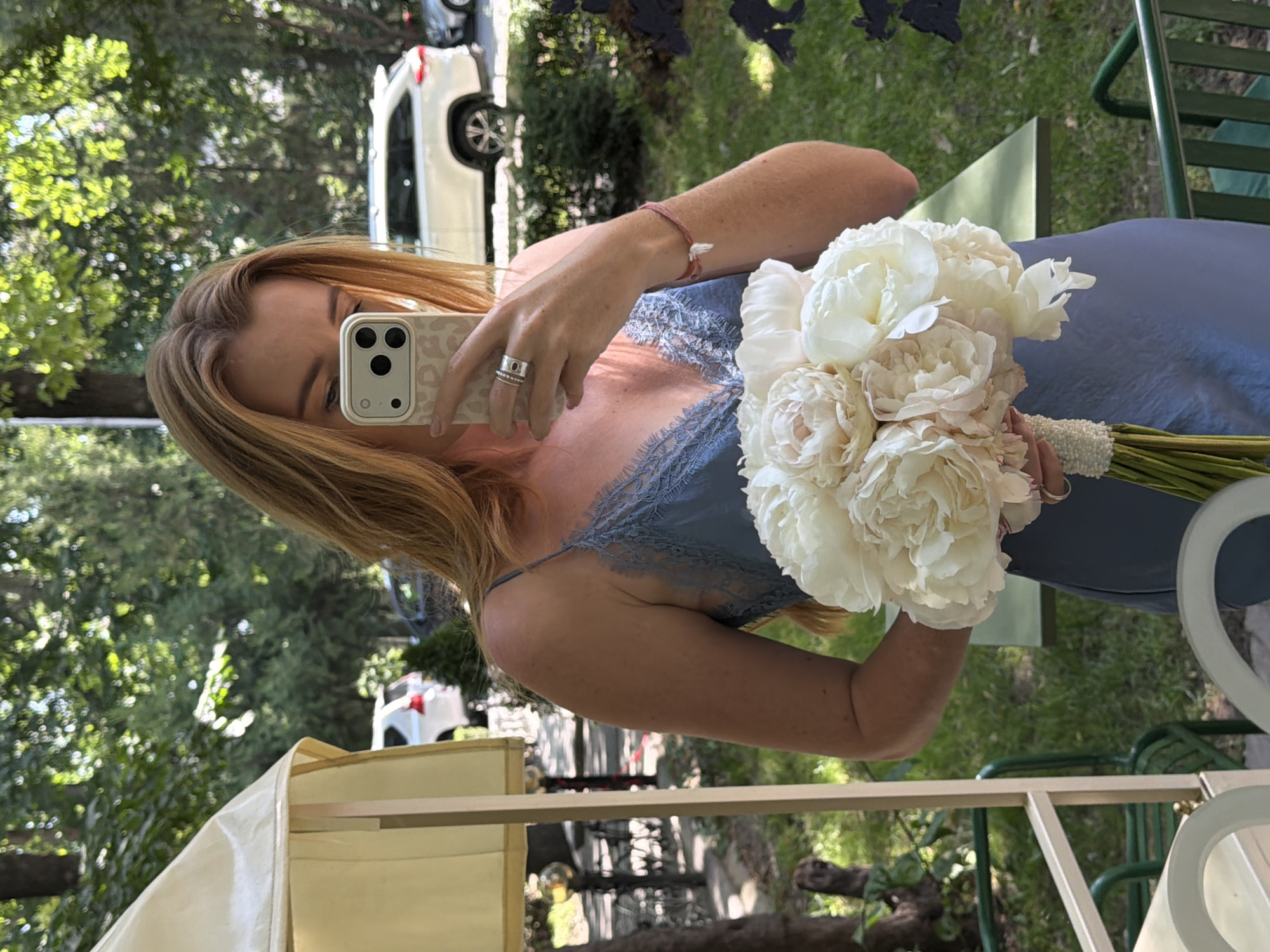 Woman documents flower bouquet selfies across Bishkek locations