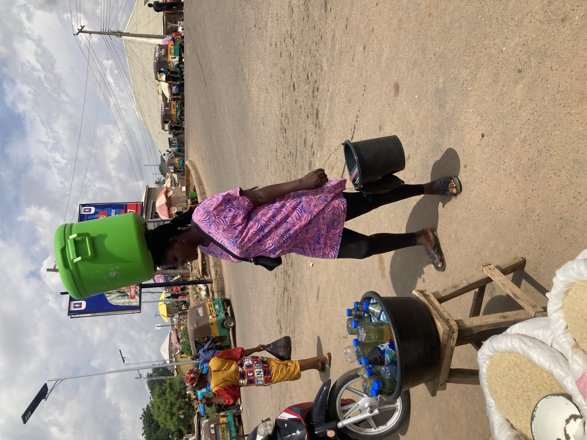 Daily life documented in Nigerian street markets and transport areas