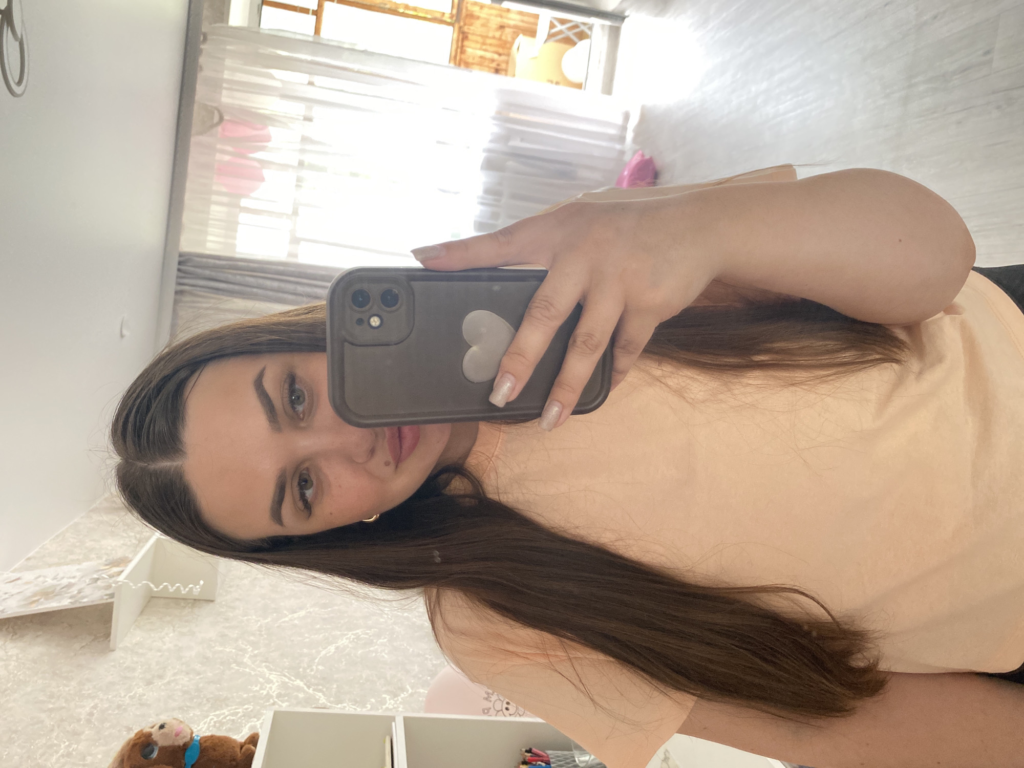 Woman takes morning selfies at home in Chaikovsky