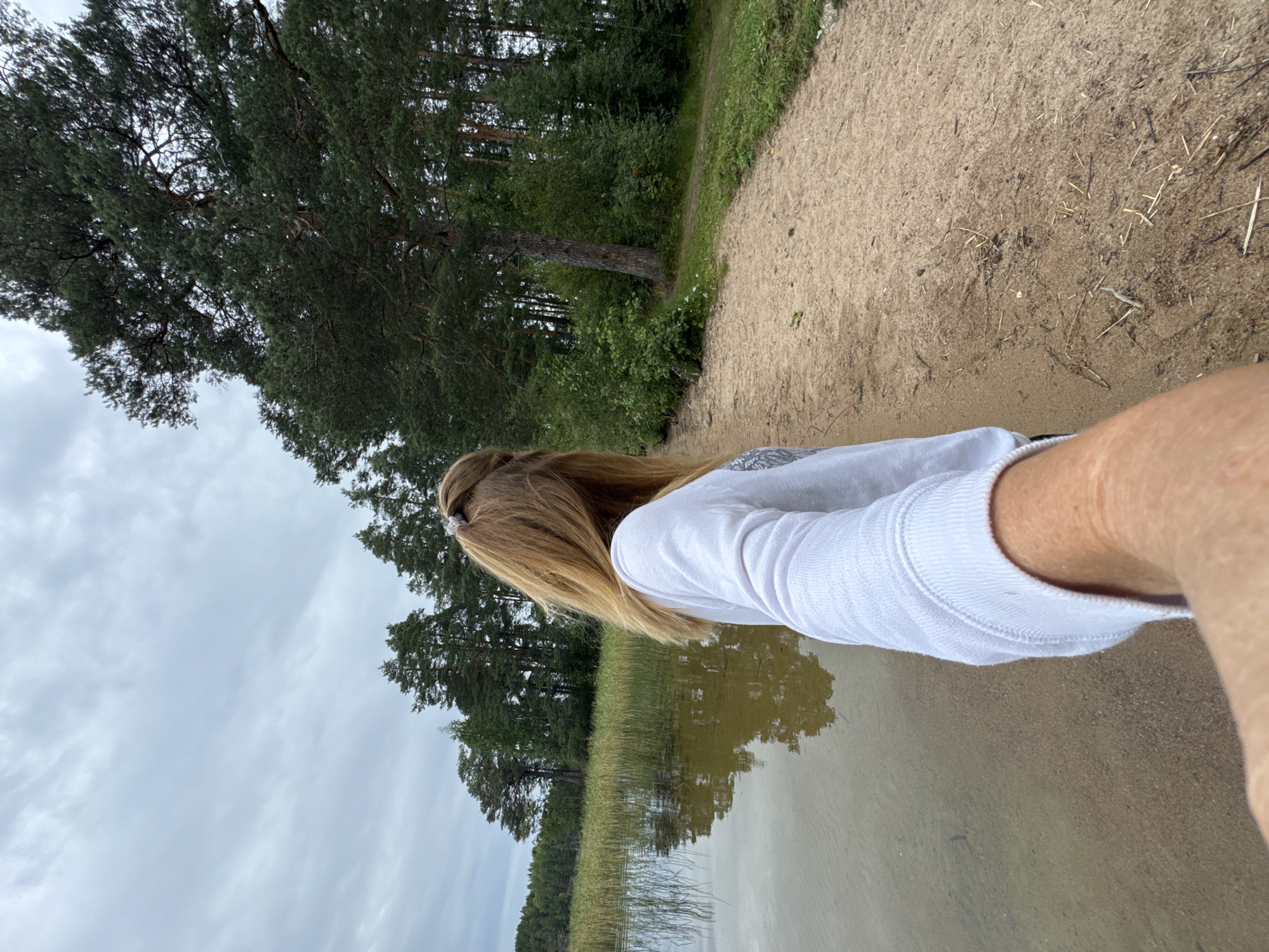 Calm afternoon at a clear, pebbly lake in Kulikovo