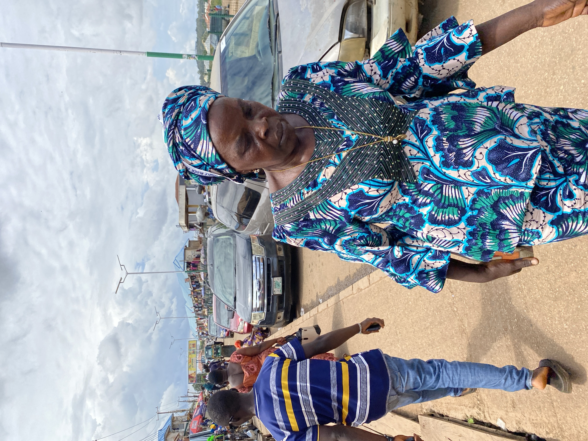 Afternoon foot traffic and street commerce in Bukuru, Nigeria