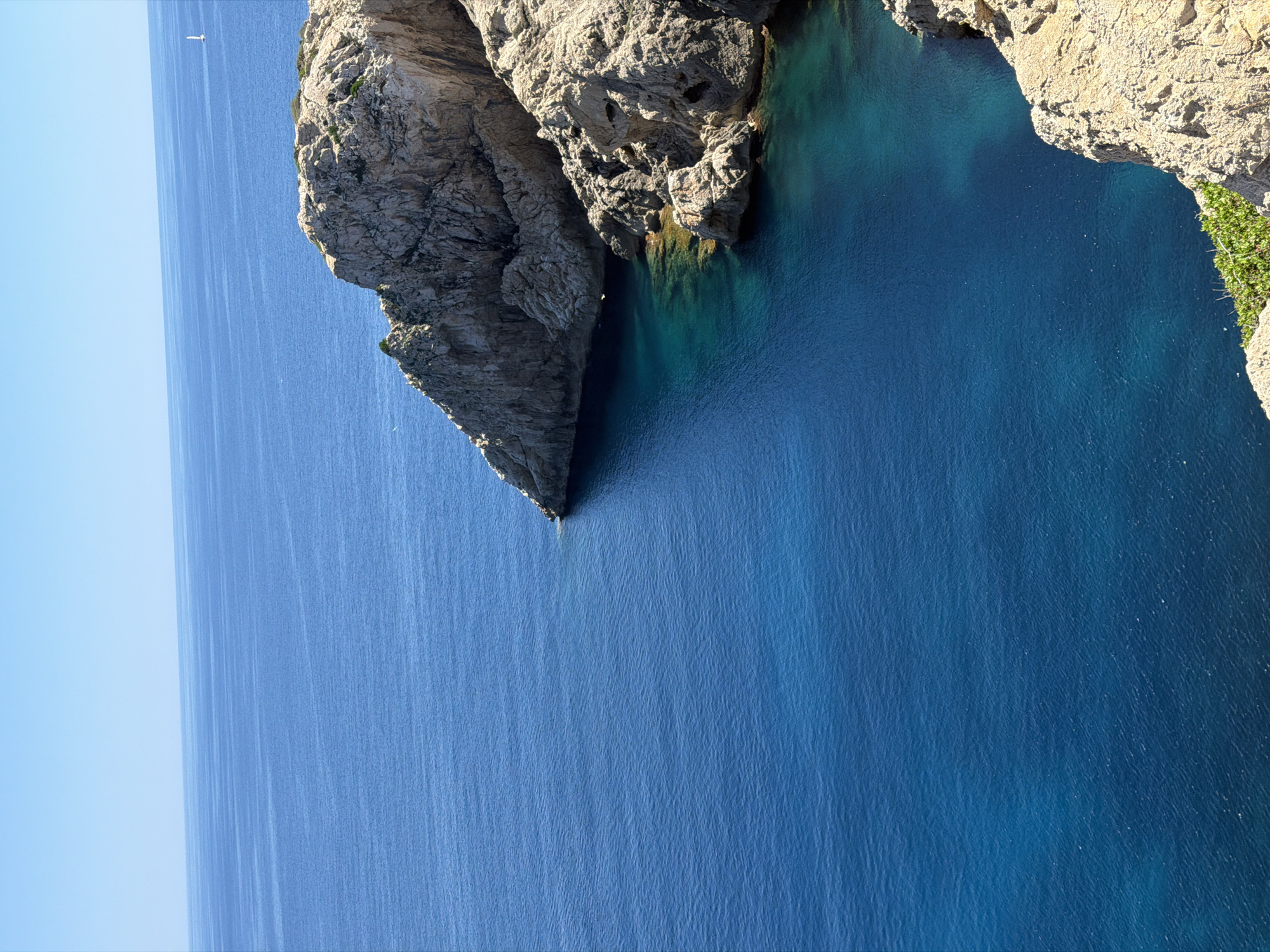 Tourists capture Mediterranean coastal scenes at Spanish seaside locations