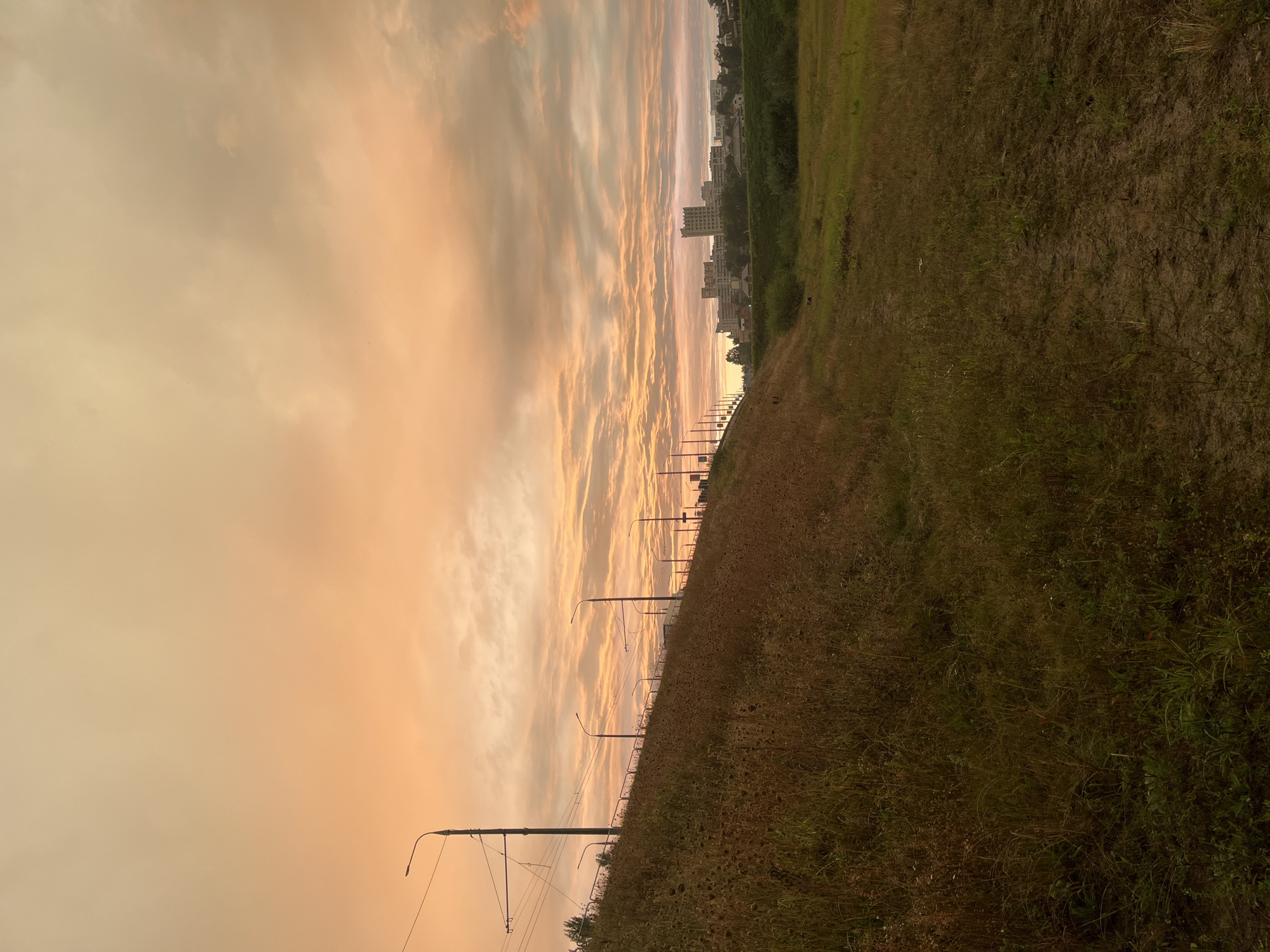 Golden dusk sky over Homyel, Belarus from a hillside