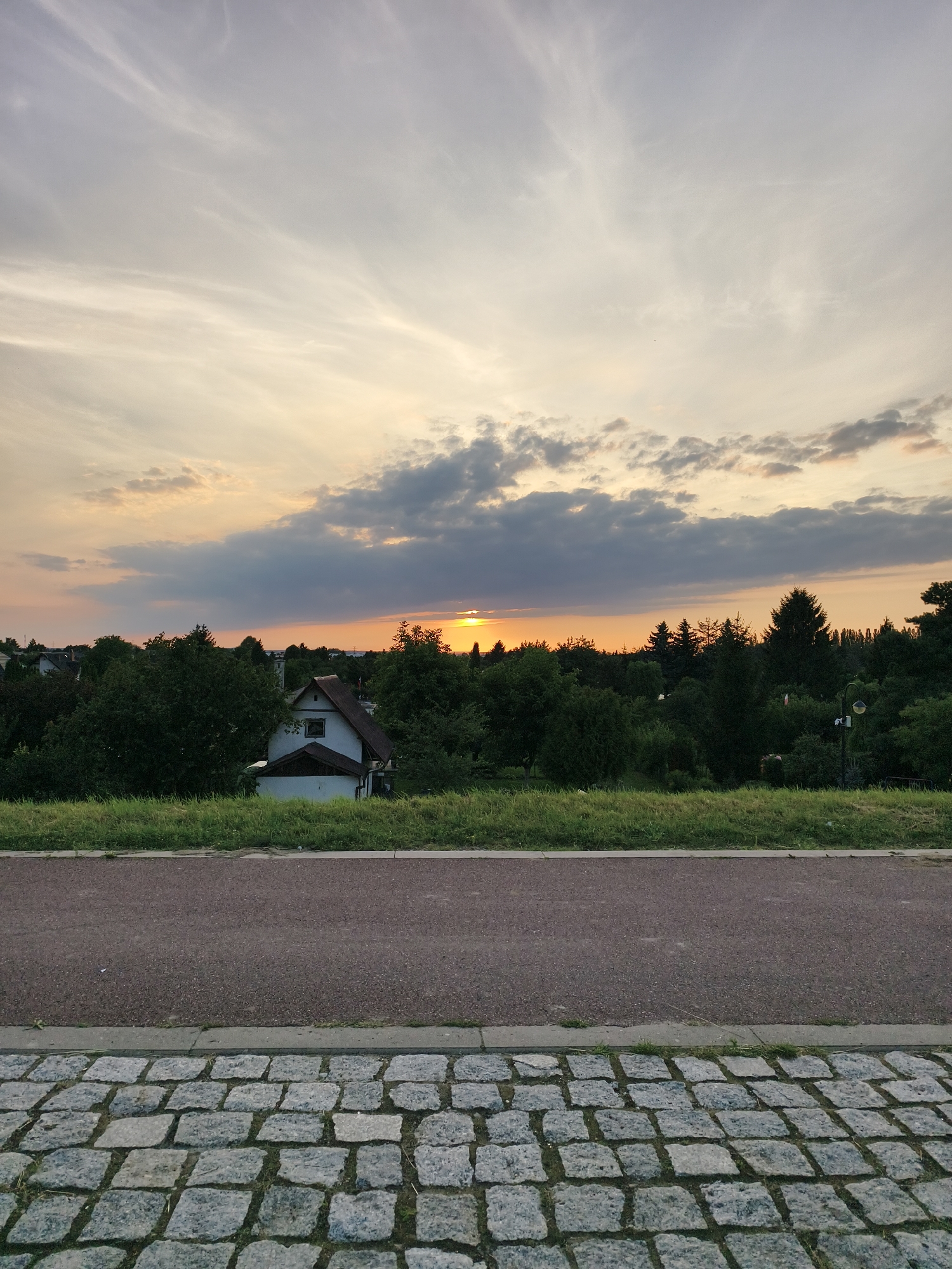 Summer sunset over Tczew, from fields to river bridge