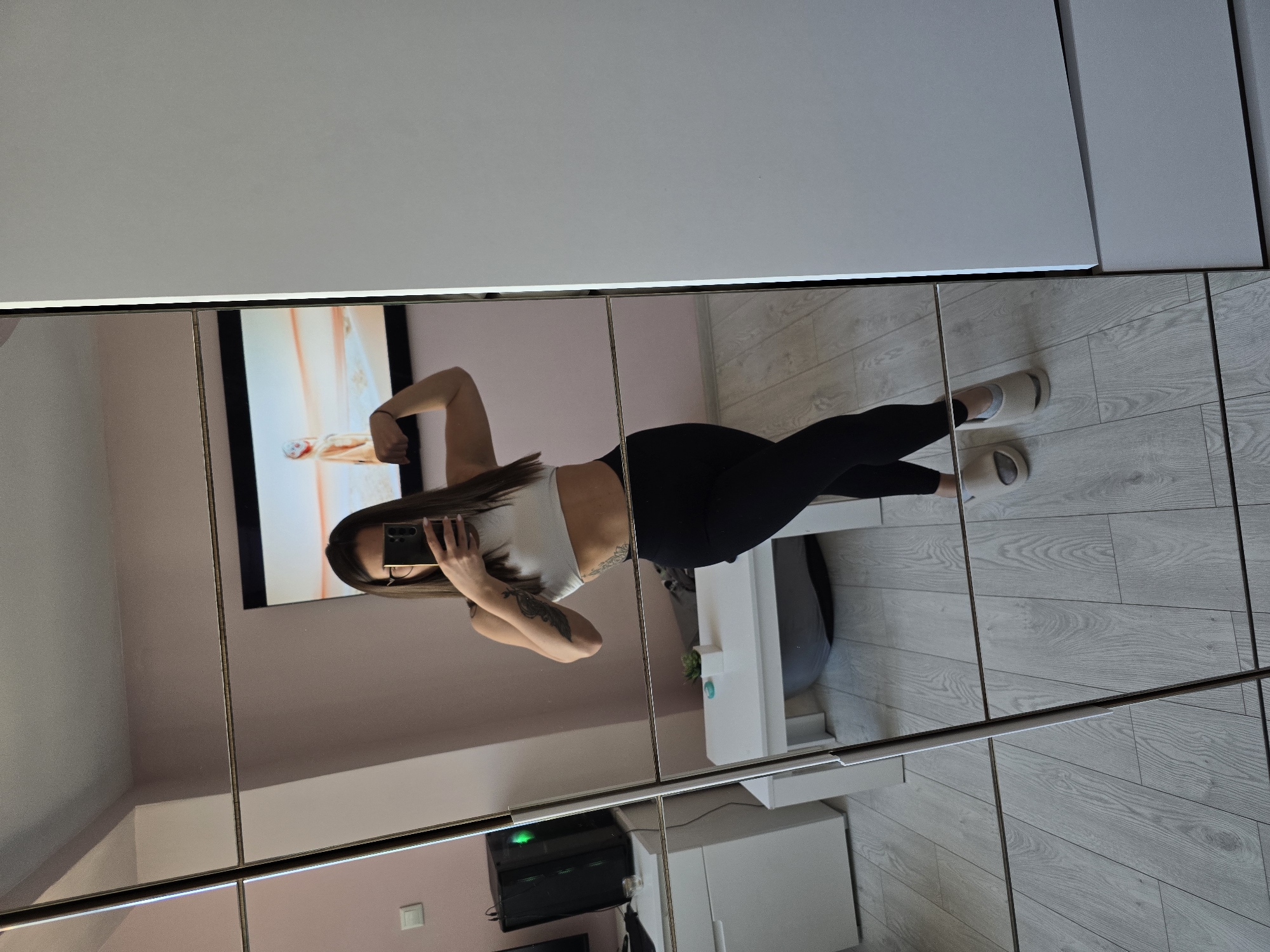 Woman poses for indoor photograph in Burgas, Bulgaria