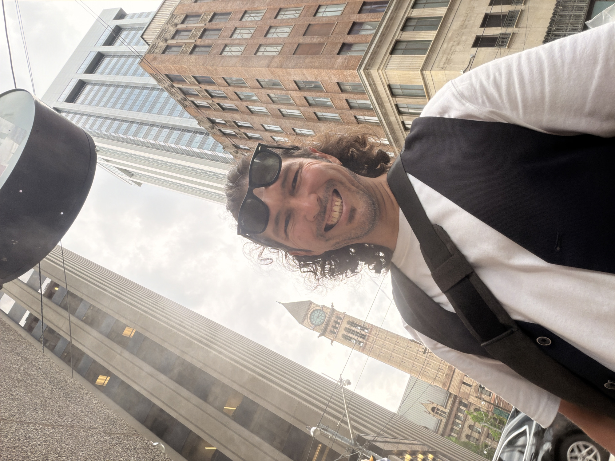 Street selfie in Toronto, low-angle wide shot