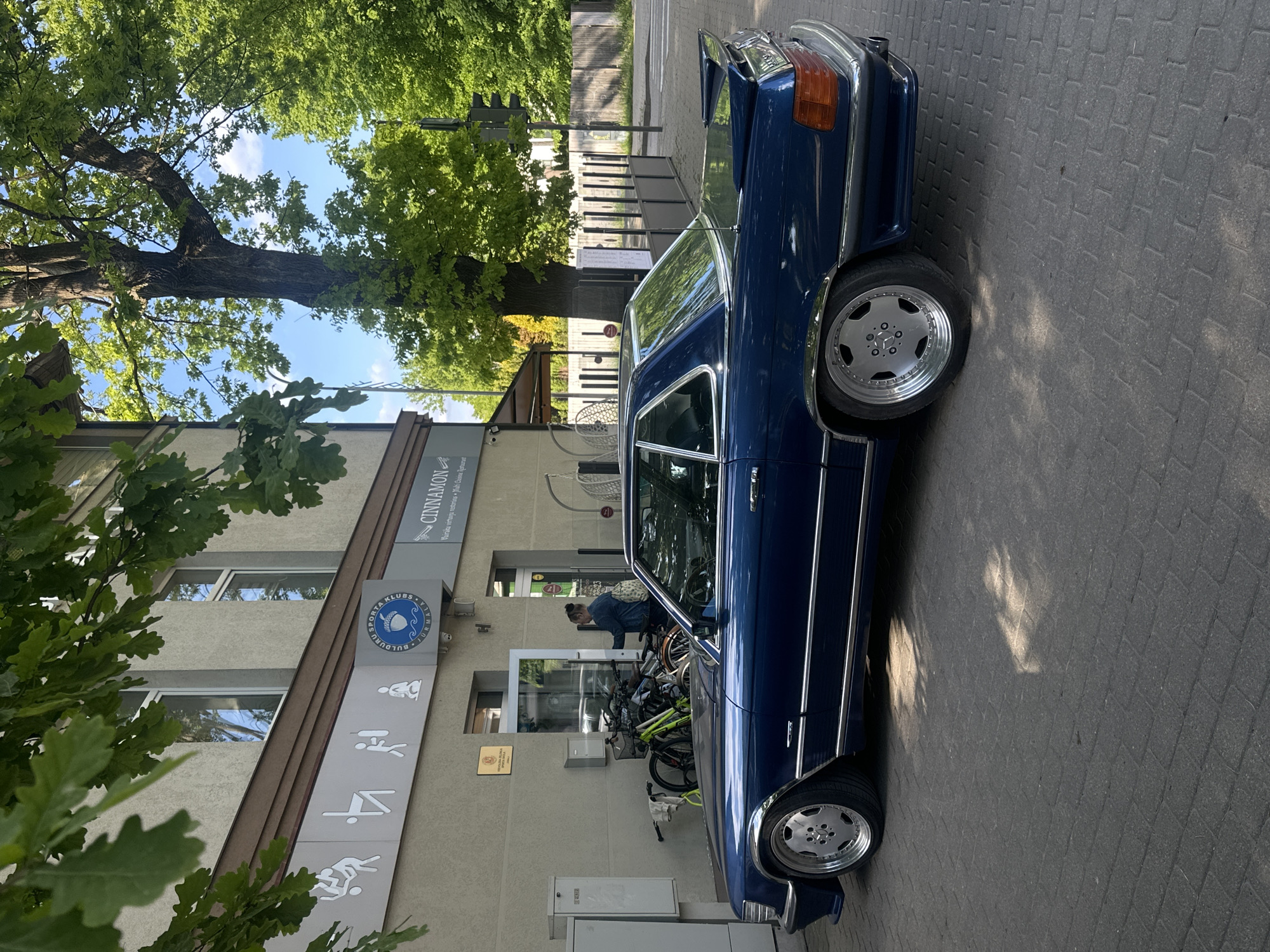 Classic cars gather on brick street in Jūrmala, Latvia