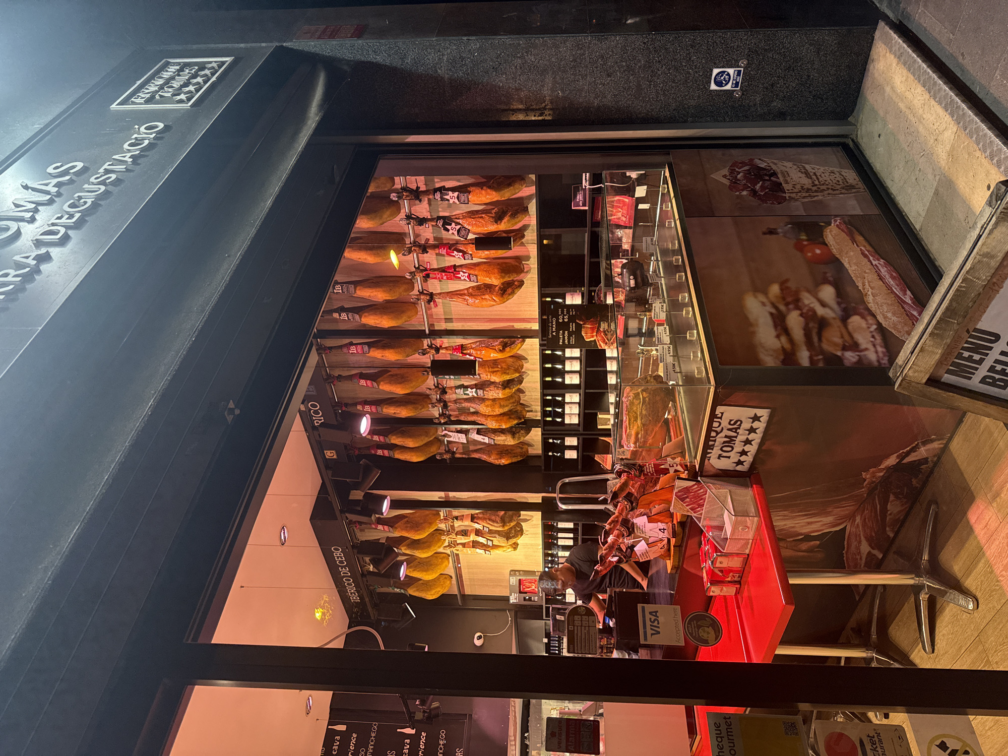 Barcelona neighborhood at dusk, local streets and storefronts