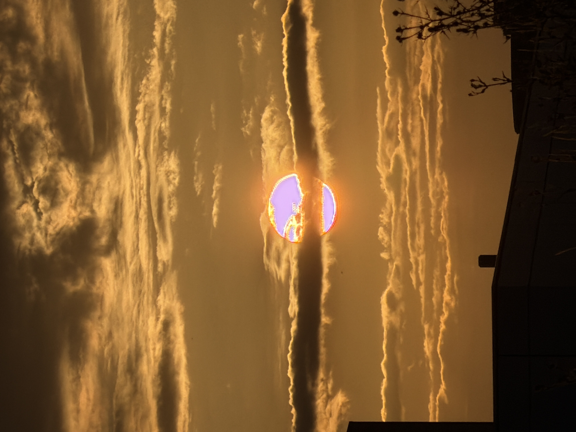 Golden sunset over Leudelange's industrial outskirts