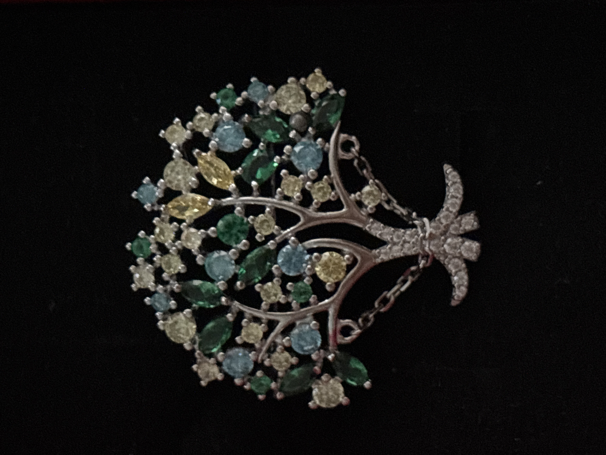 Macro shots of jewelry, dried florals, and fresh produce